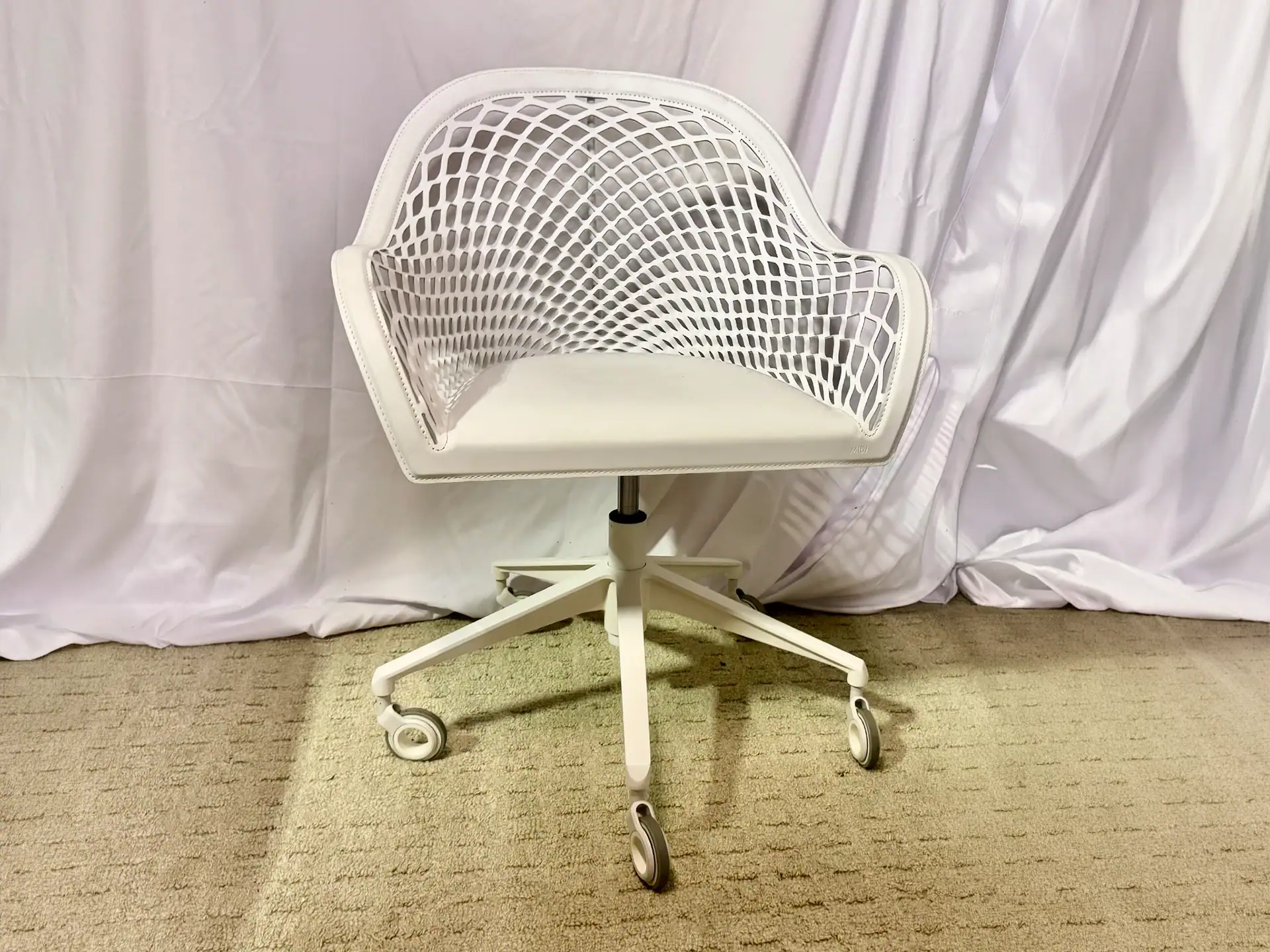White office chair with a woven backrest and adjustable height.