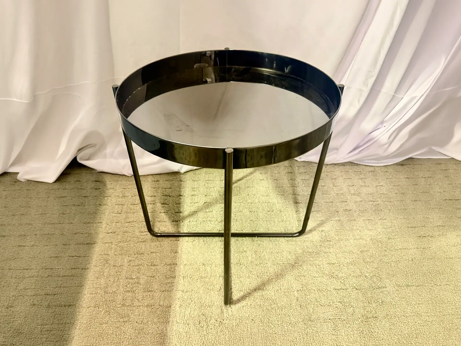 Modern black metal side table with glass top from Sklar Furnishings.