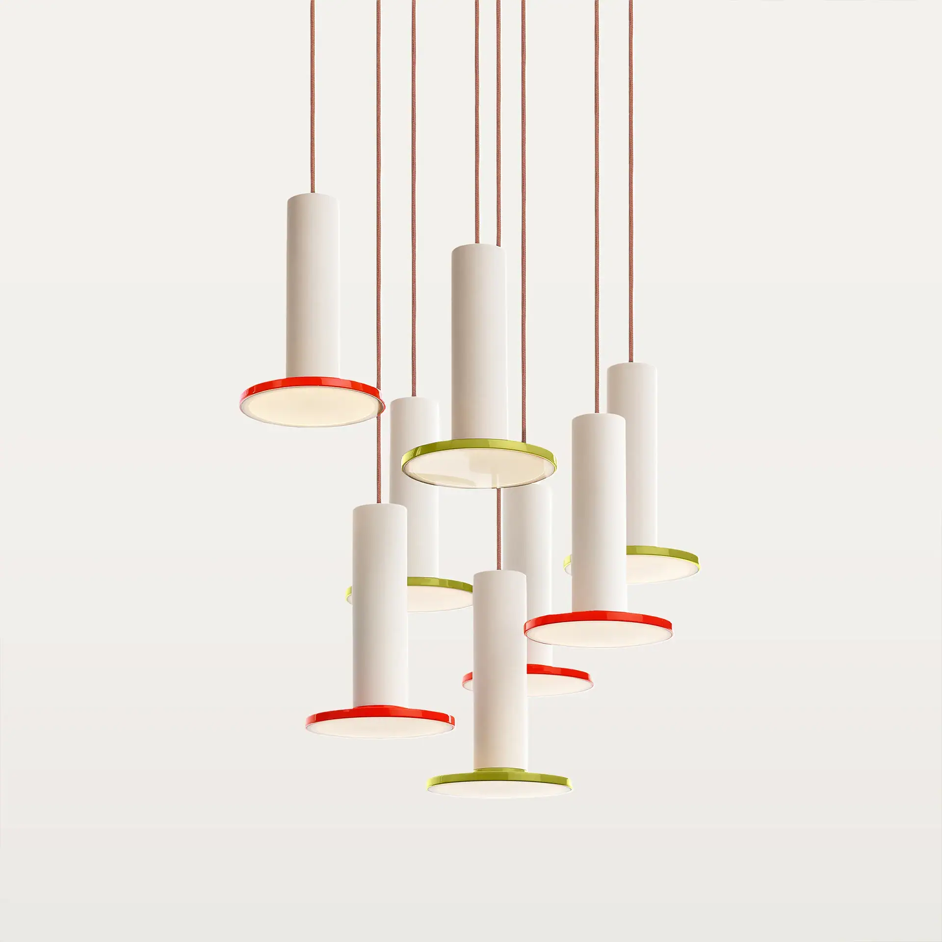Contemporary pendant light fixture with cylindrical shapes and colorful accents.