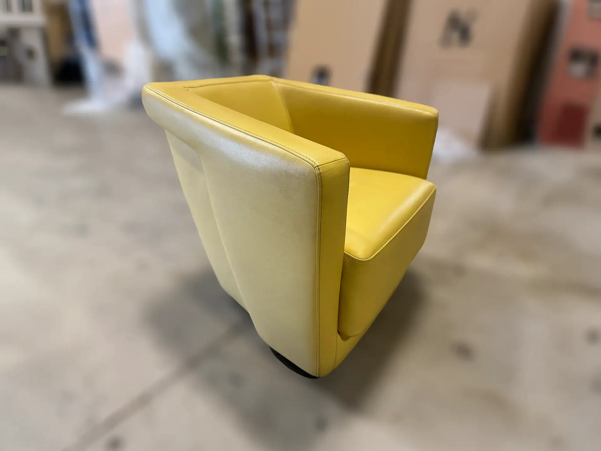 Yellow lounge chair with sleek design and comfortable cushioning.