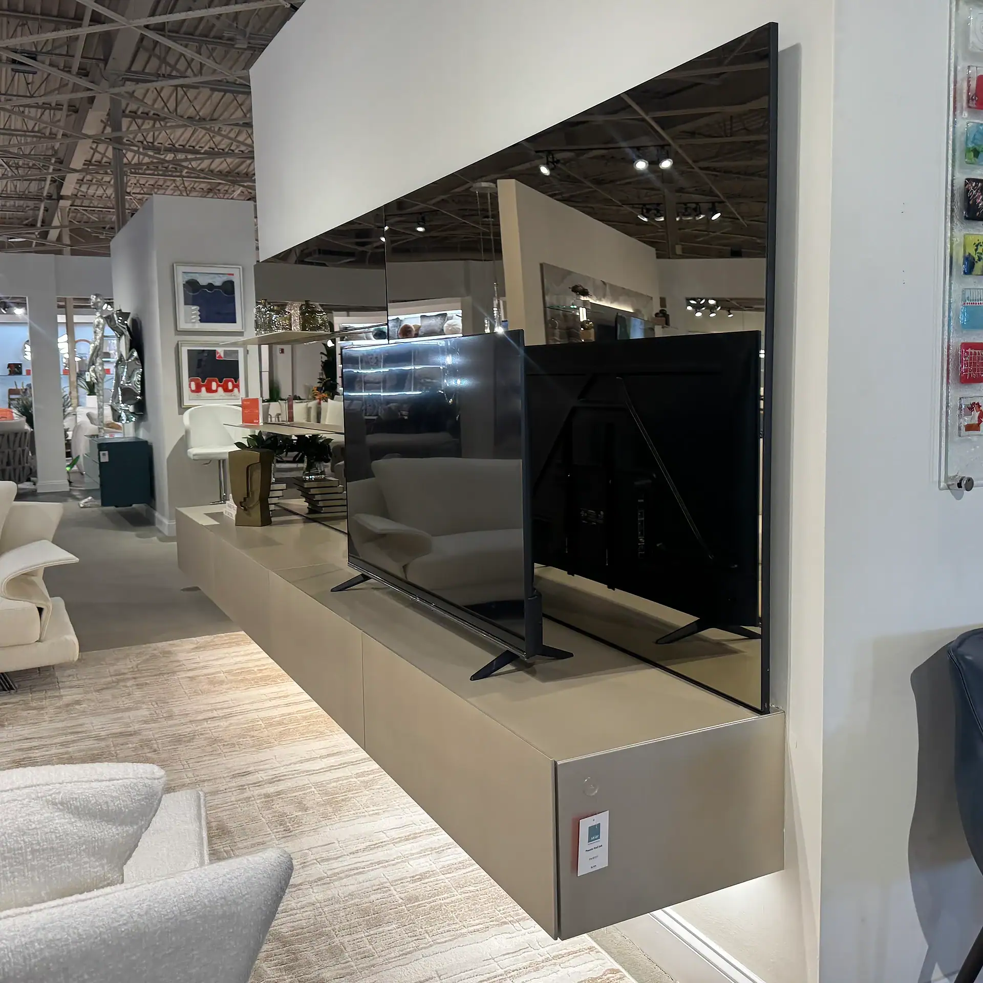 Contemporary TV wall unit with sleek design and storage options.