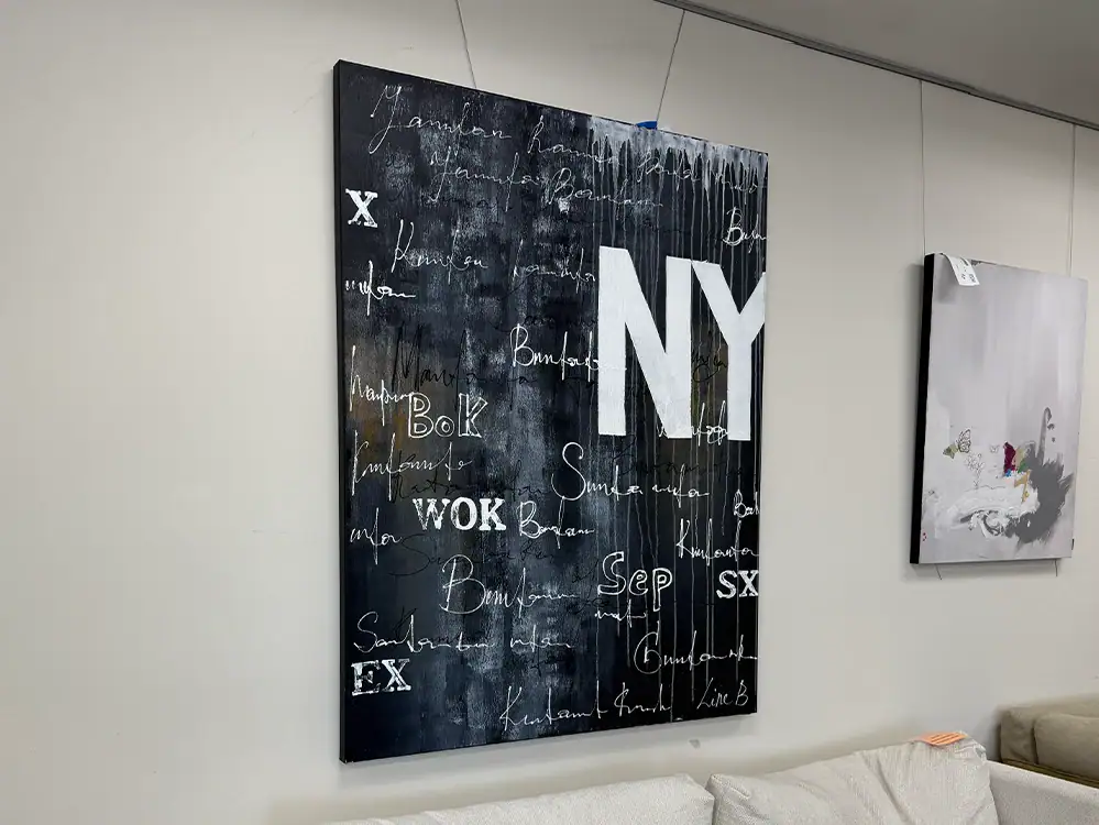 Contemporary NYC-inspired artwork featuring bold letters and handwritten script on a black backgroun.