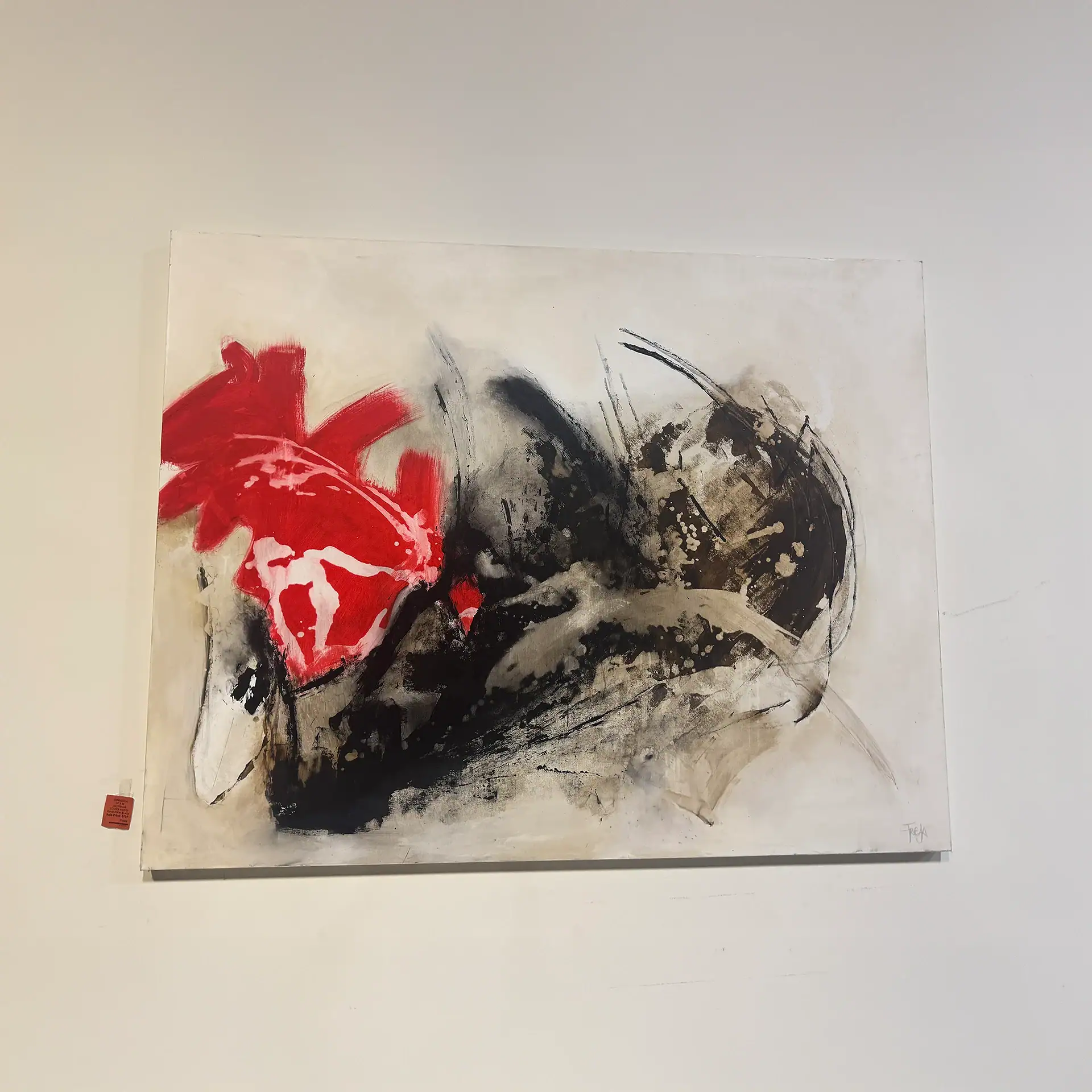 Abstract wall art with red, black, and beige brushstrokes for modern decor.