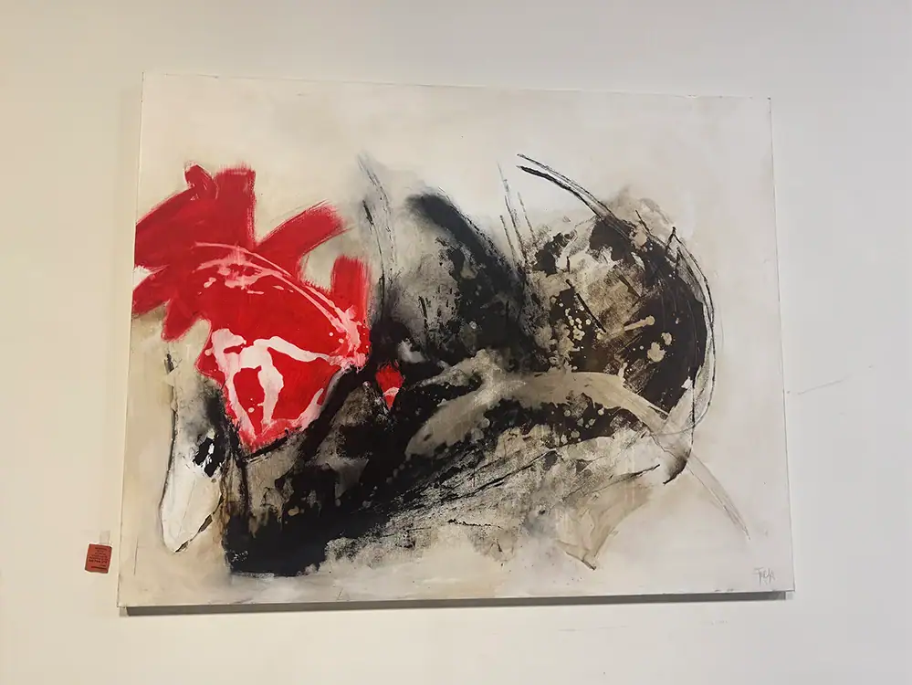 Abstract wall art with red, black, and beige brushstrokes for modern decor.