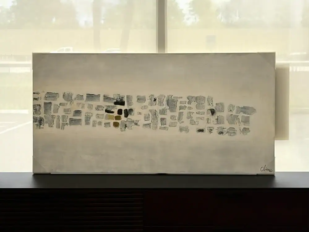 Modern stone wall art piece with neutral tones for home decor.