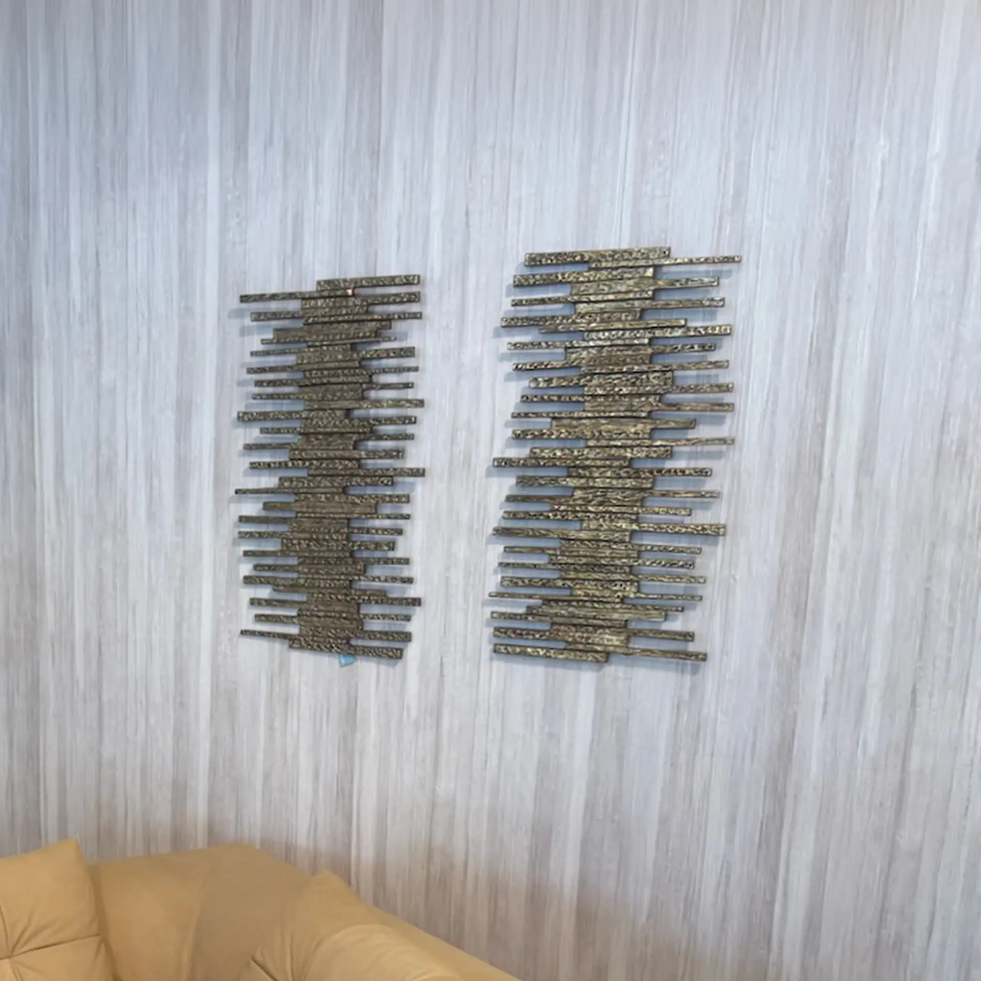 Modern metallic ledger wall decor with geometric design for interior decor.