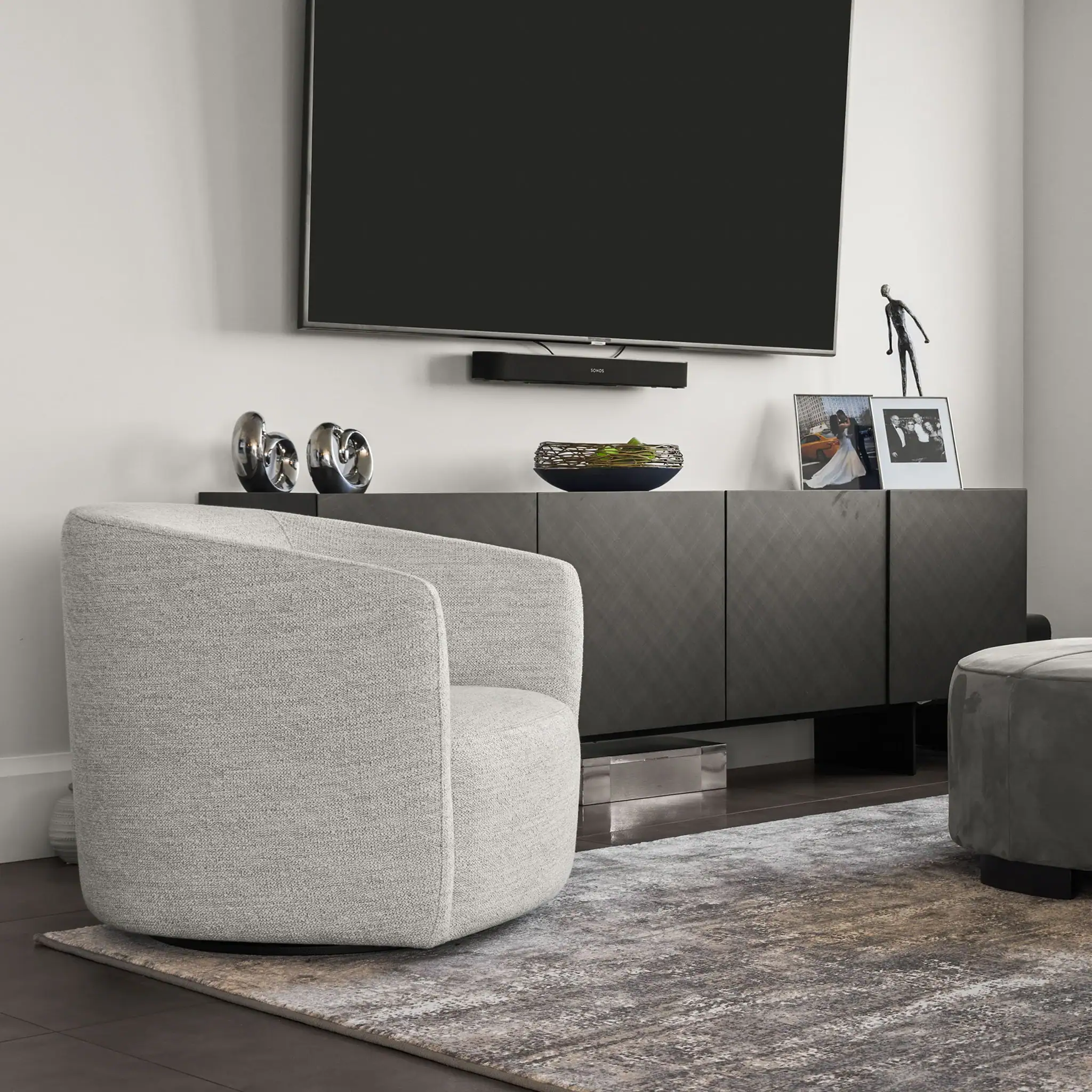 Elegant living room with contemporary furniture, TV, and decorative accents for a modern home.