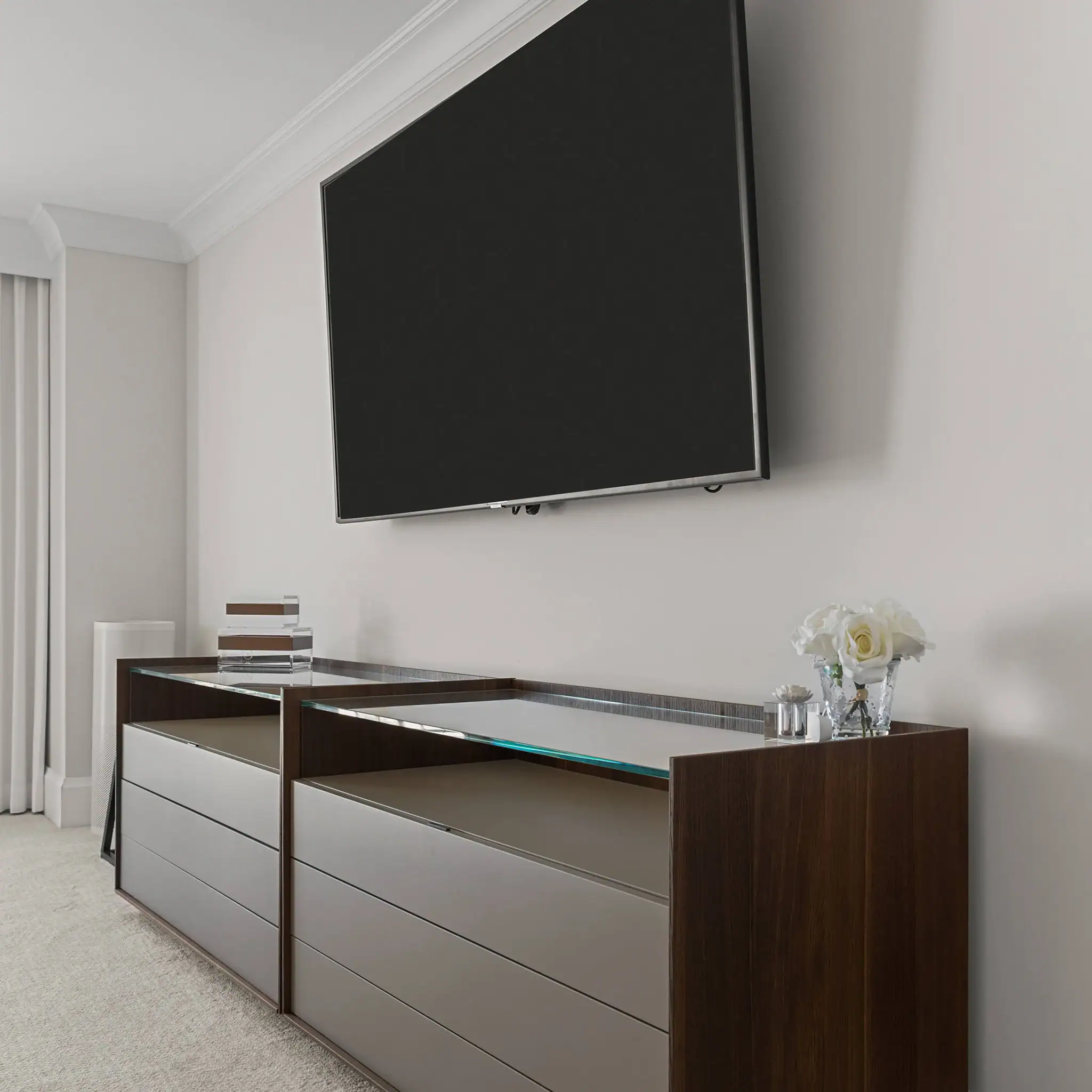 Modern TV console with mounted flat-screen TV in a stylish living room.