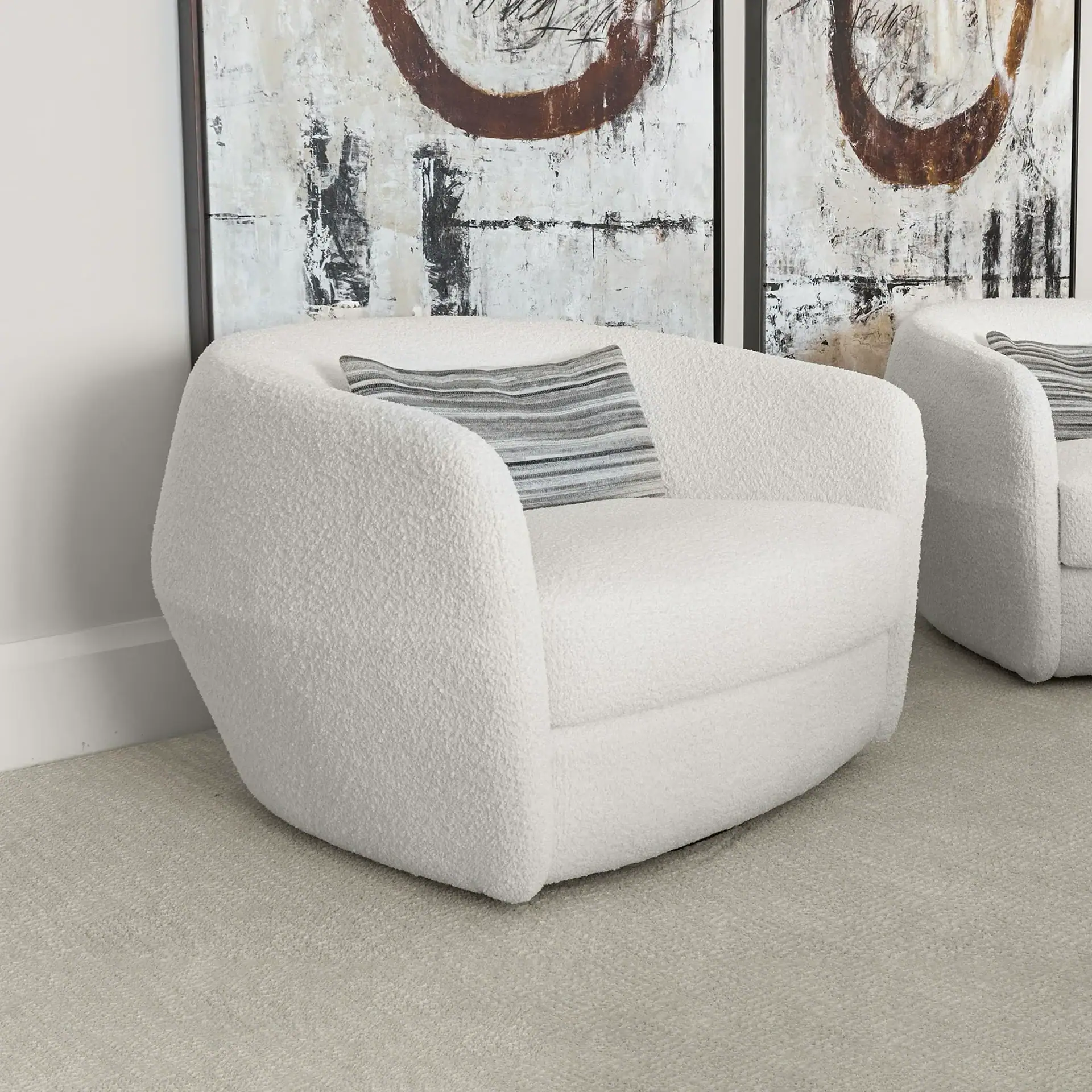 Modern white upholstered armchair with plush fabric, perfect for contemporary living rooms.