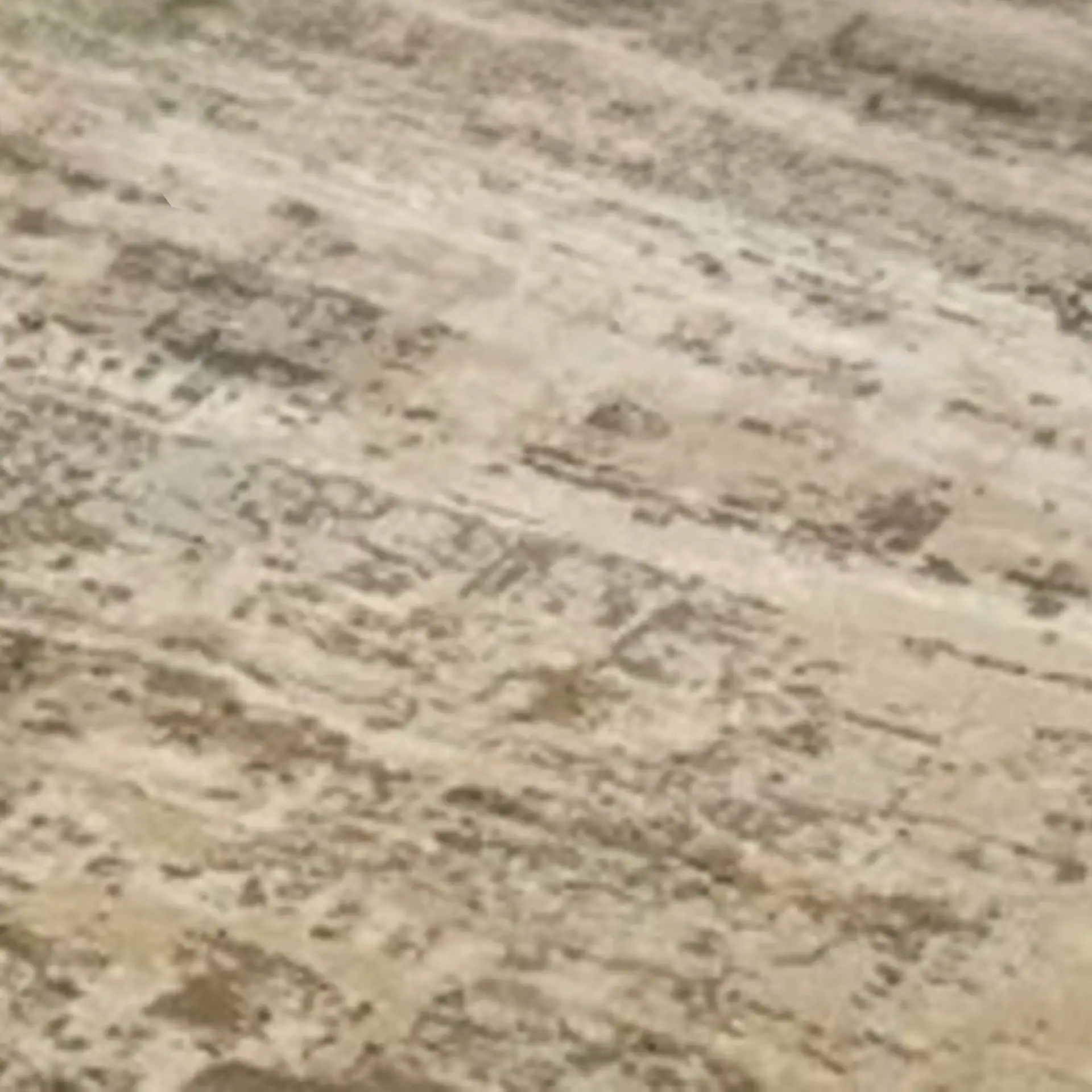 Marble countertop with natural veining and polished finish.