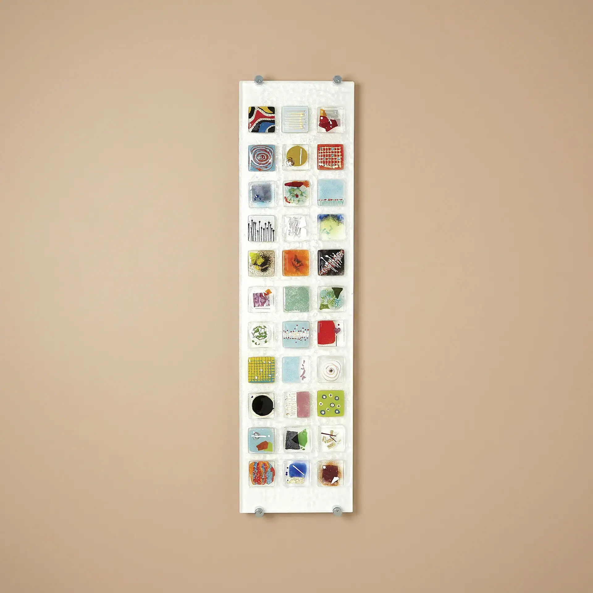 Colorful fused glass wall art panel with various glass designs and textures.