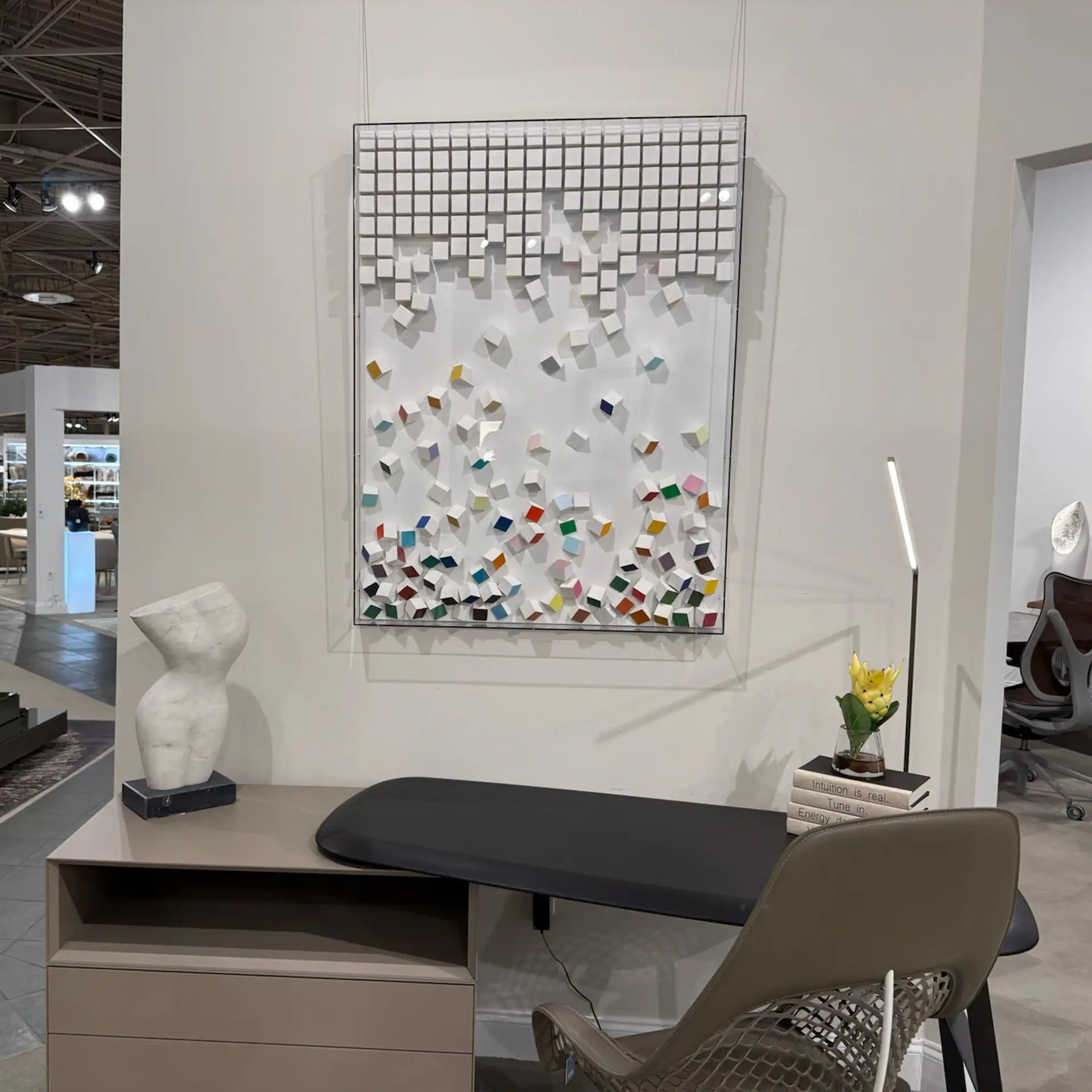 Contemporary wall art with colorful geometric shapes on a white background.