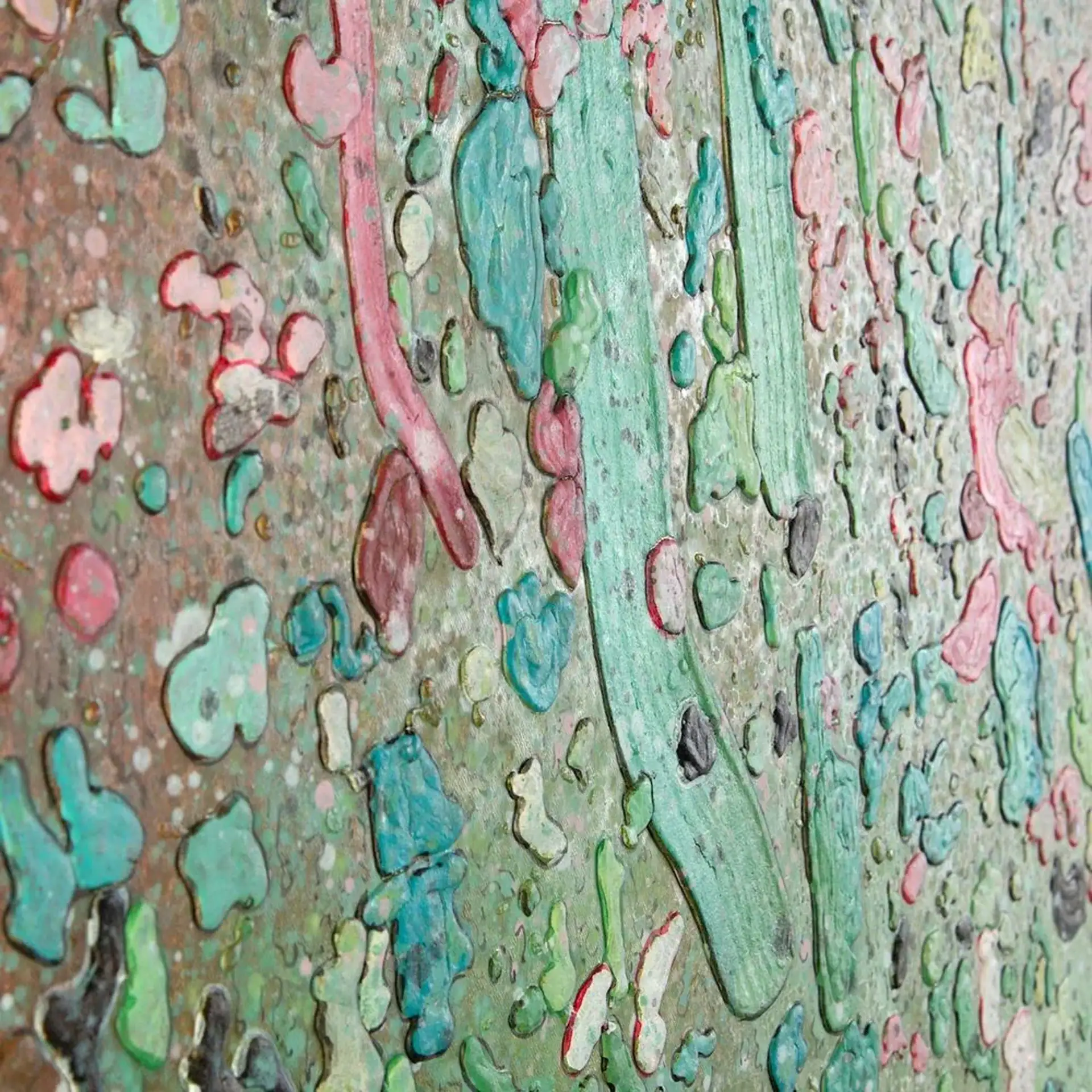 Colorful textured wall art with vibrant paint splashes and layered patterns.
