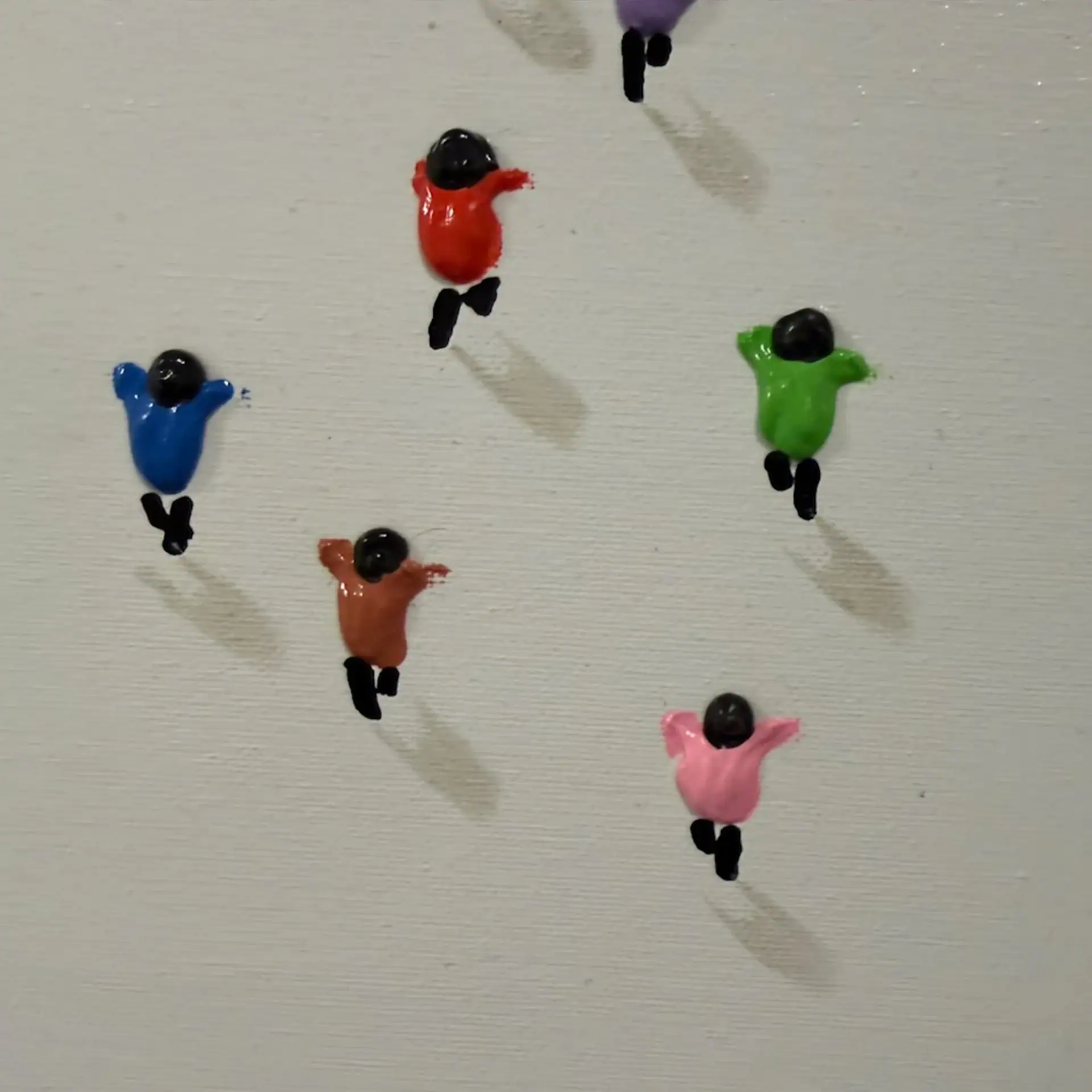 Colorful bird-shaped wall hooks for home decor and functional organization.