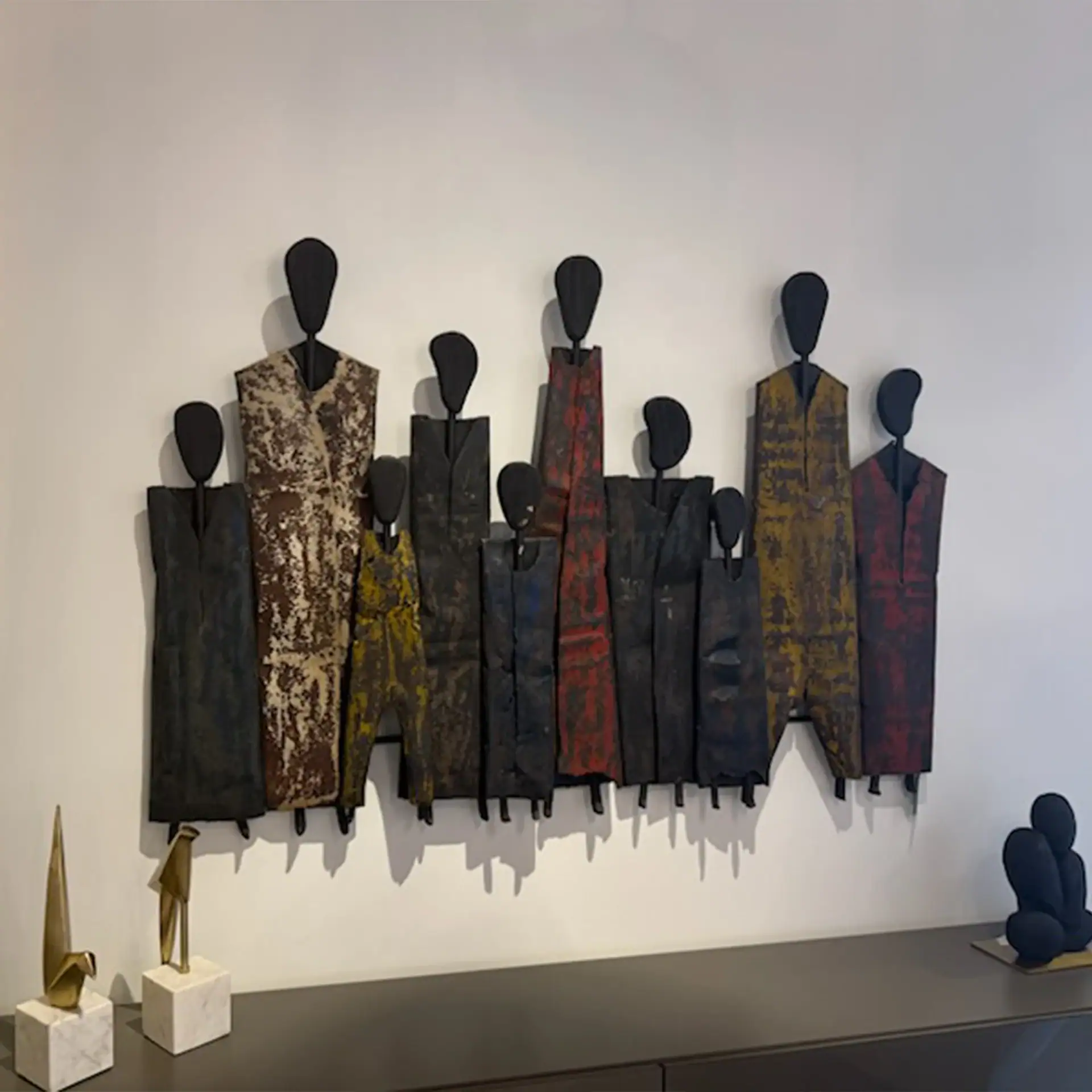 Contemporary metal wall sculpture featuring vibrant geometric figures for stylish interior design.