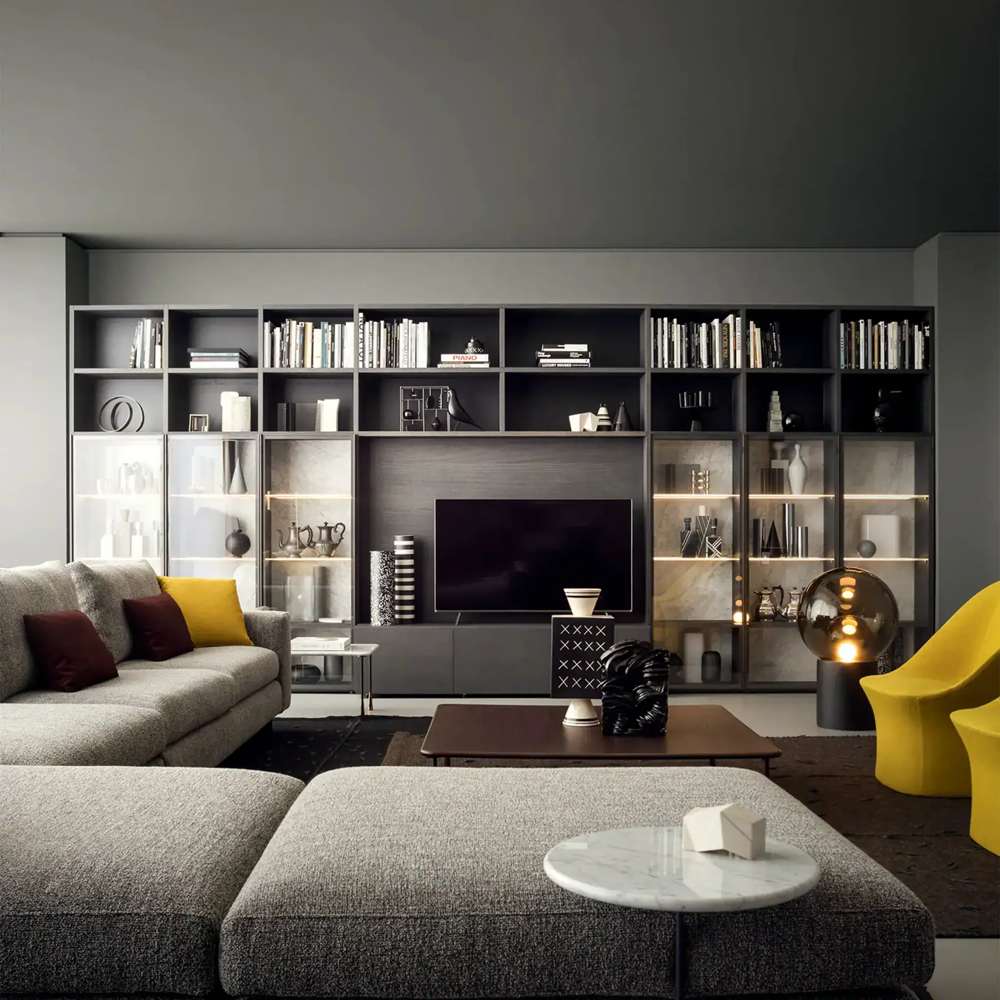 Modern modular wall system with built-in shelves and TV setup in living room.