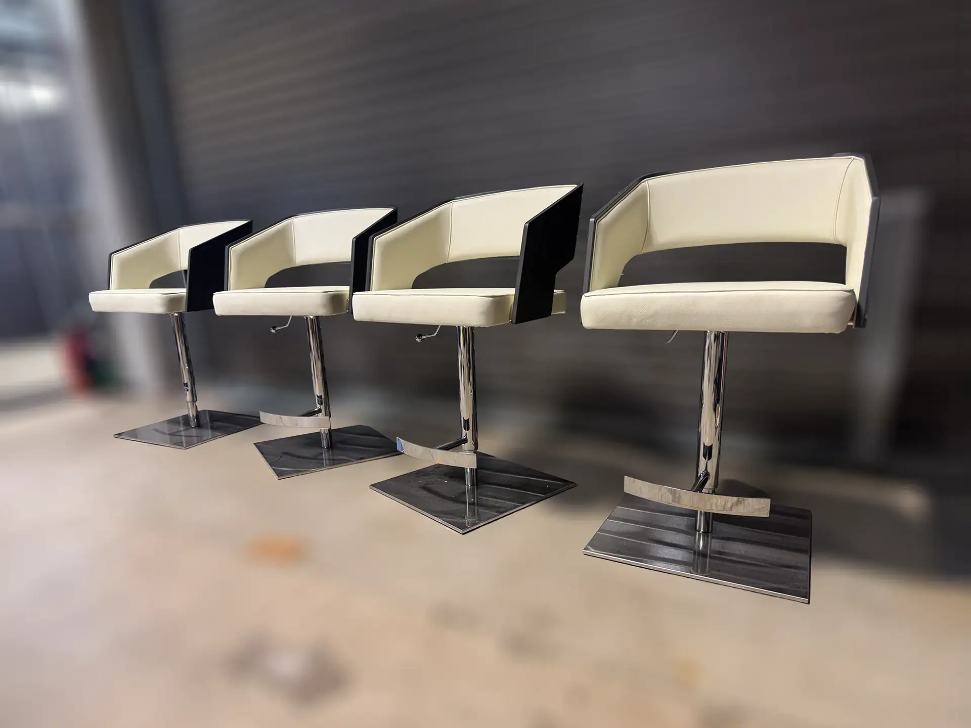 Modern white and black adjustable barstools for stylish seating.