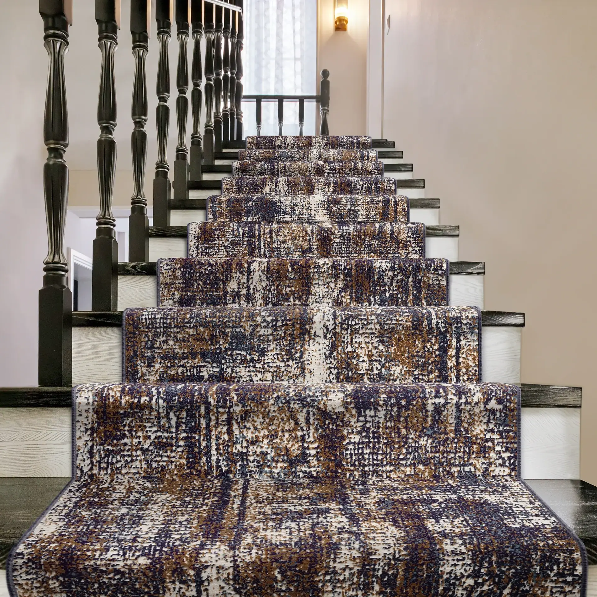 Staircase with a stylish, patterned runner rug, black wooden balusters, and white walls.