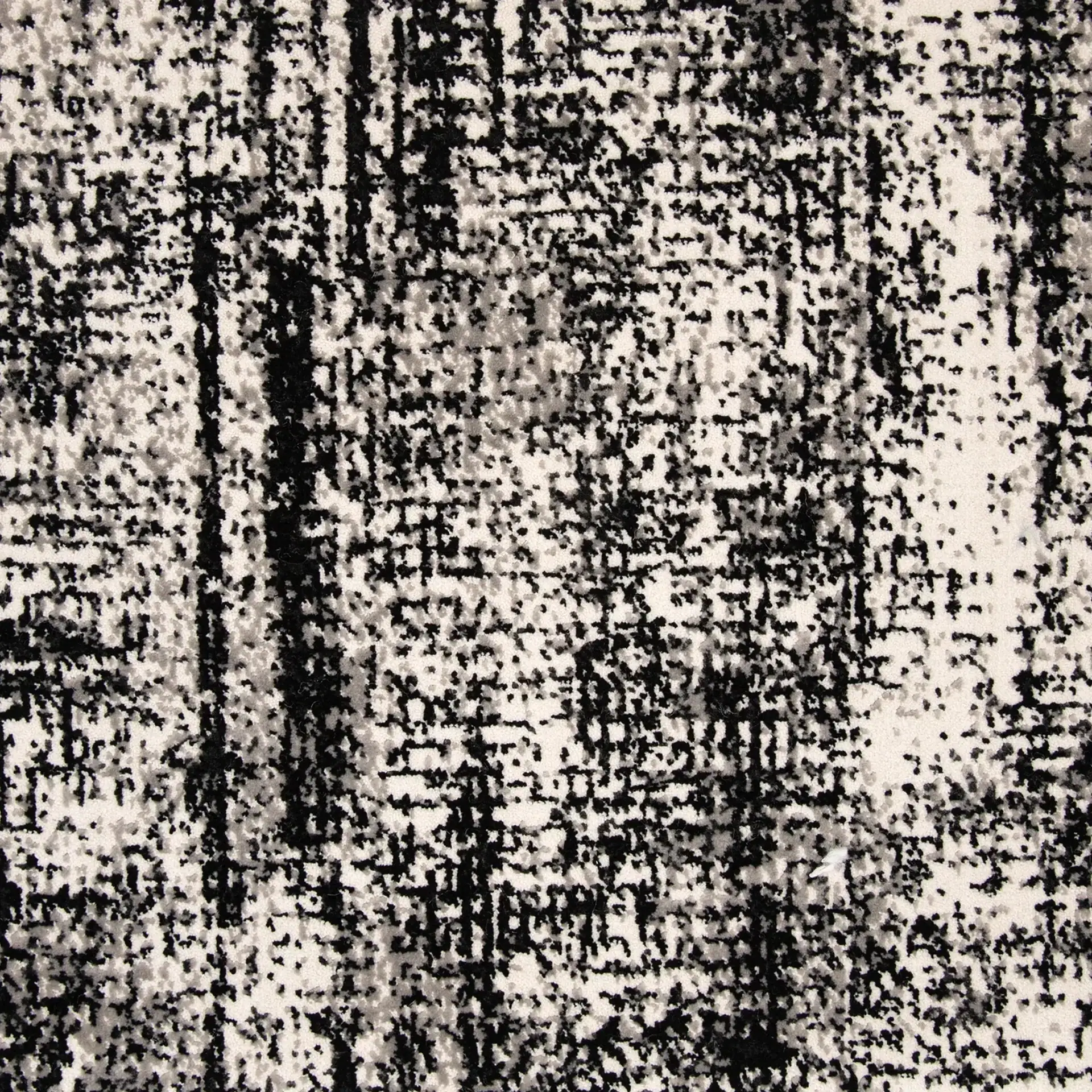 Black and white abstract patterned rug for contemporary interiors.