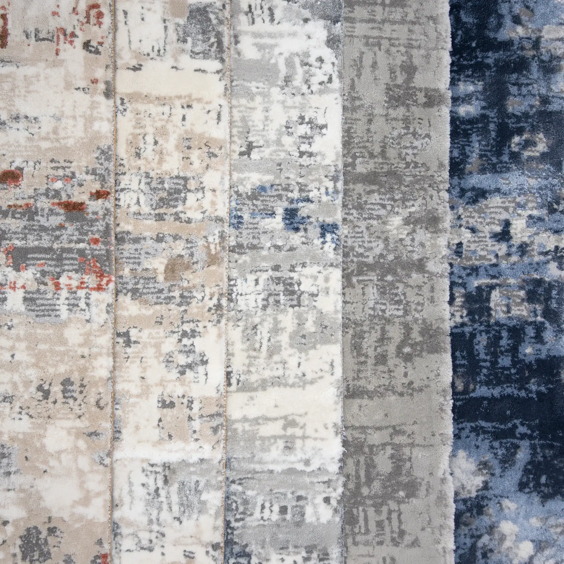 Distressed area rugs featuring neutral and blue shades, perfect for enhancing contemporary living sp.