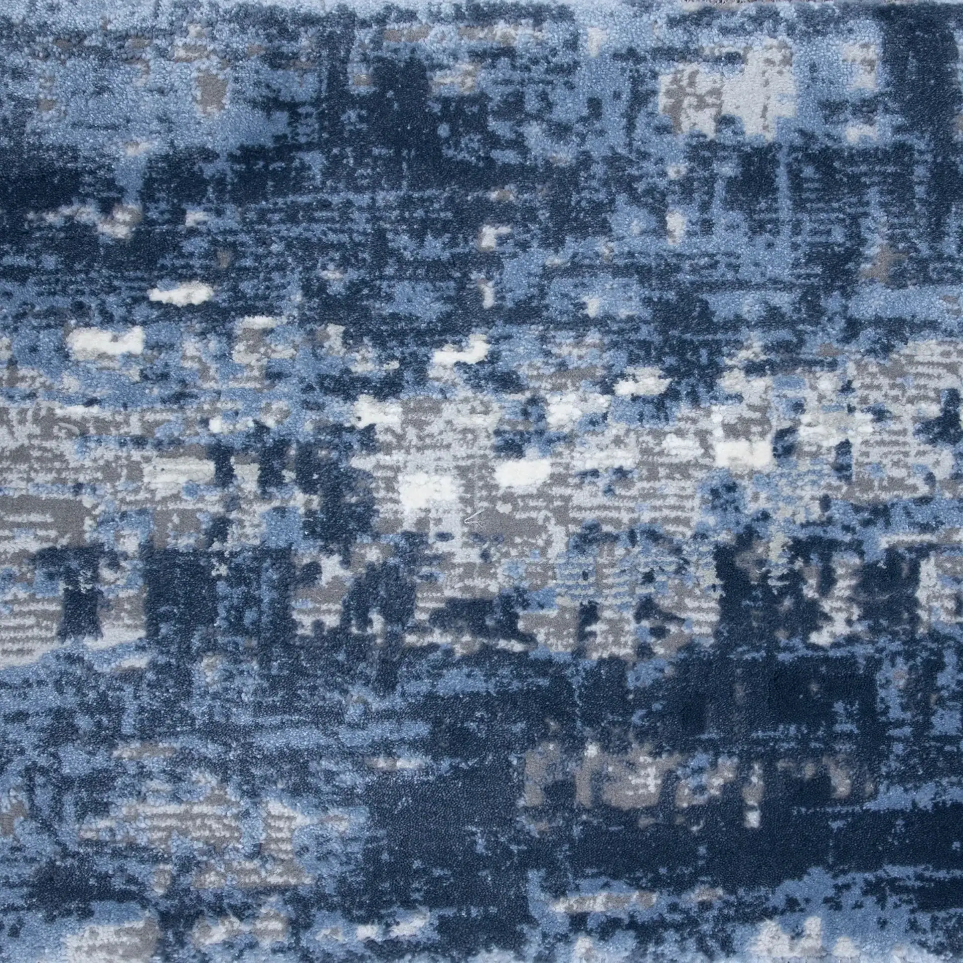Contemporary blue abstract rug with textured design for stylish living spaces.