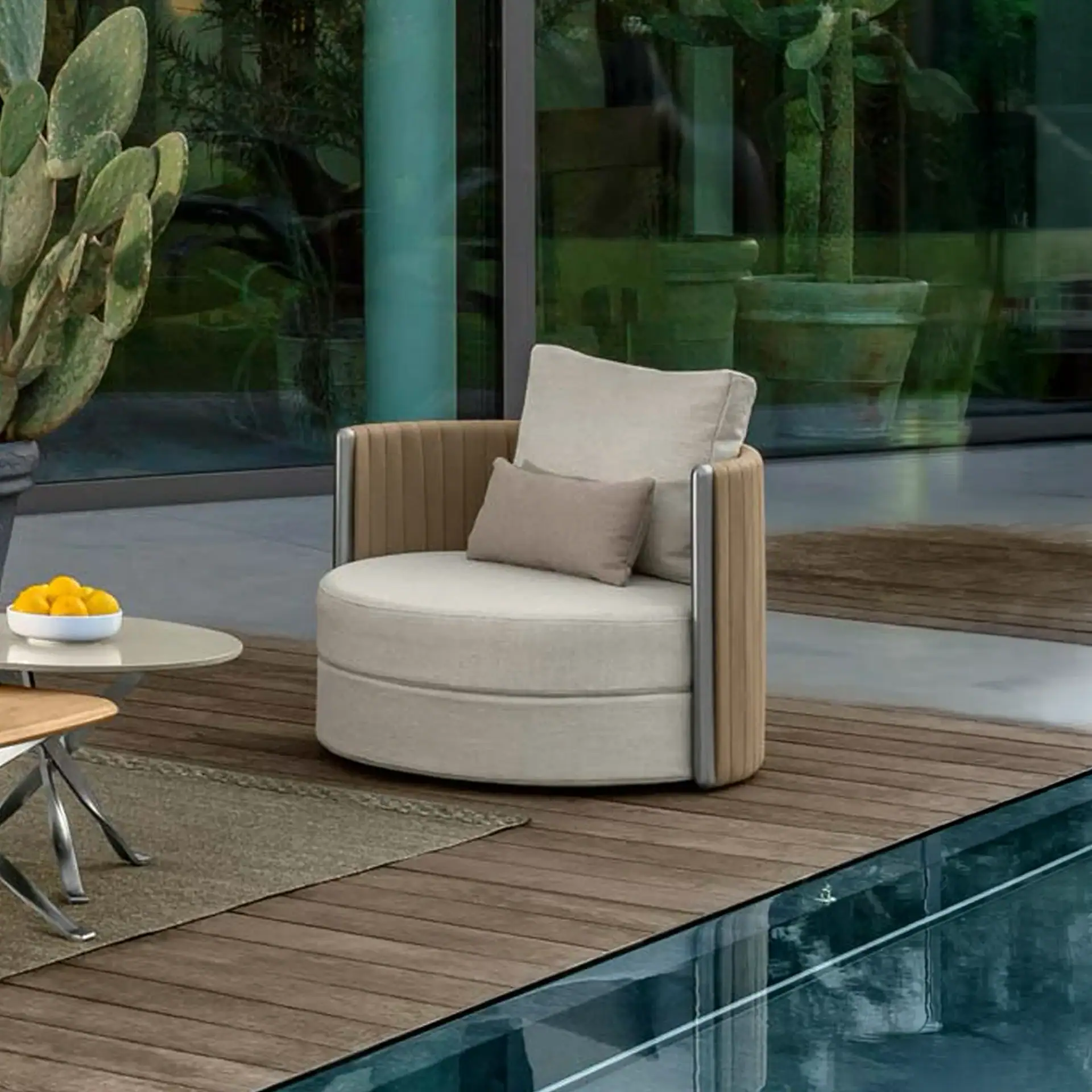 Stylish modern round lounge chair with cushions, perfect for contemporary living spaces.