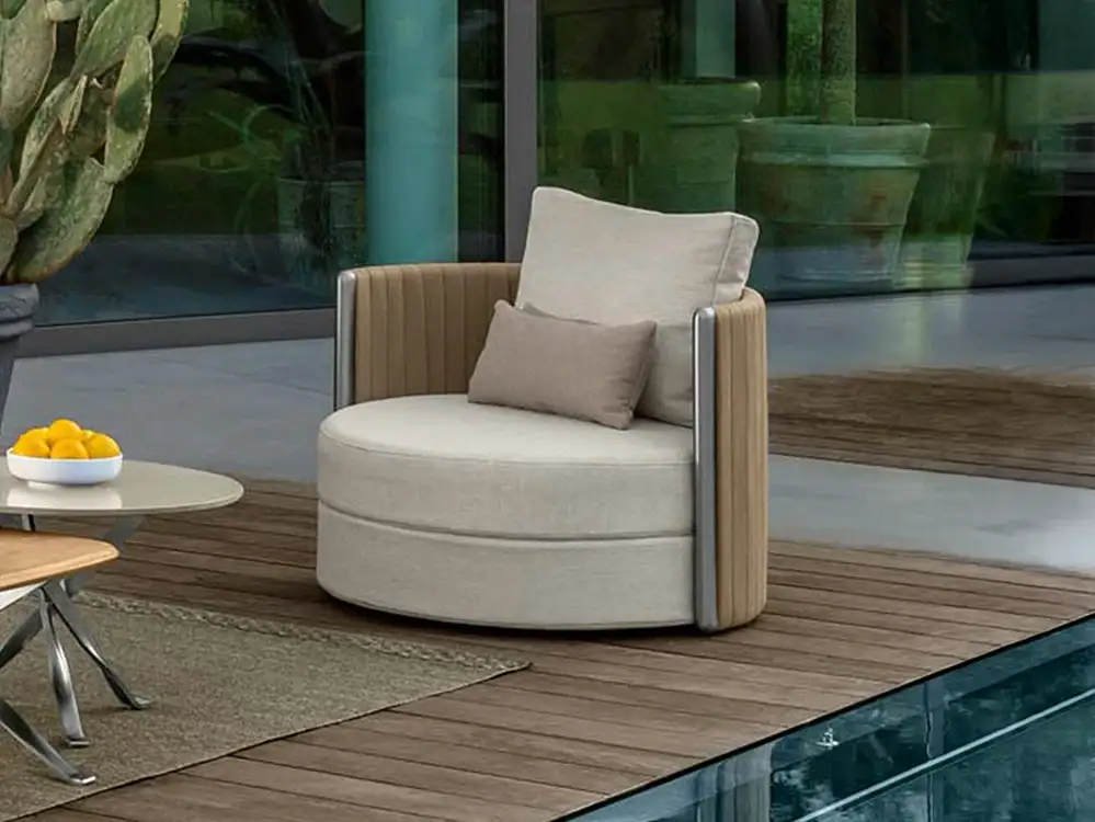 Modern round lounge chair with beige upholstery and wooden accents.