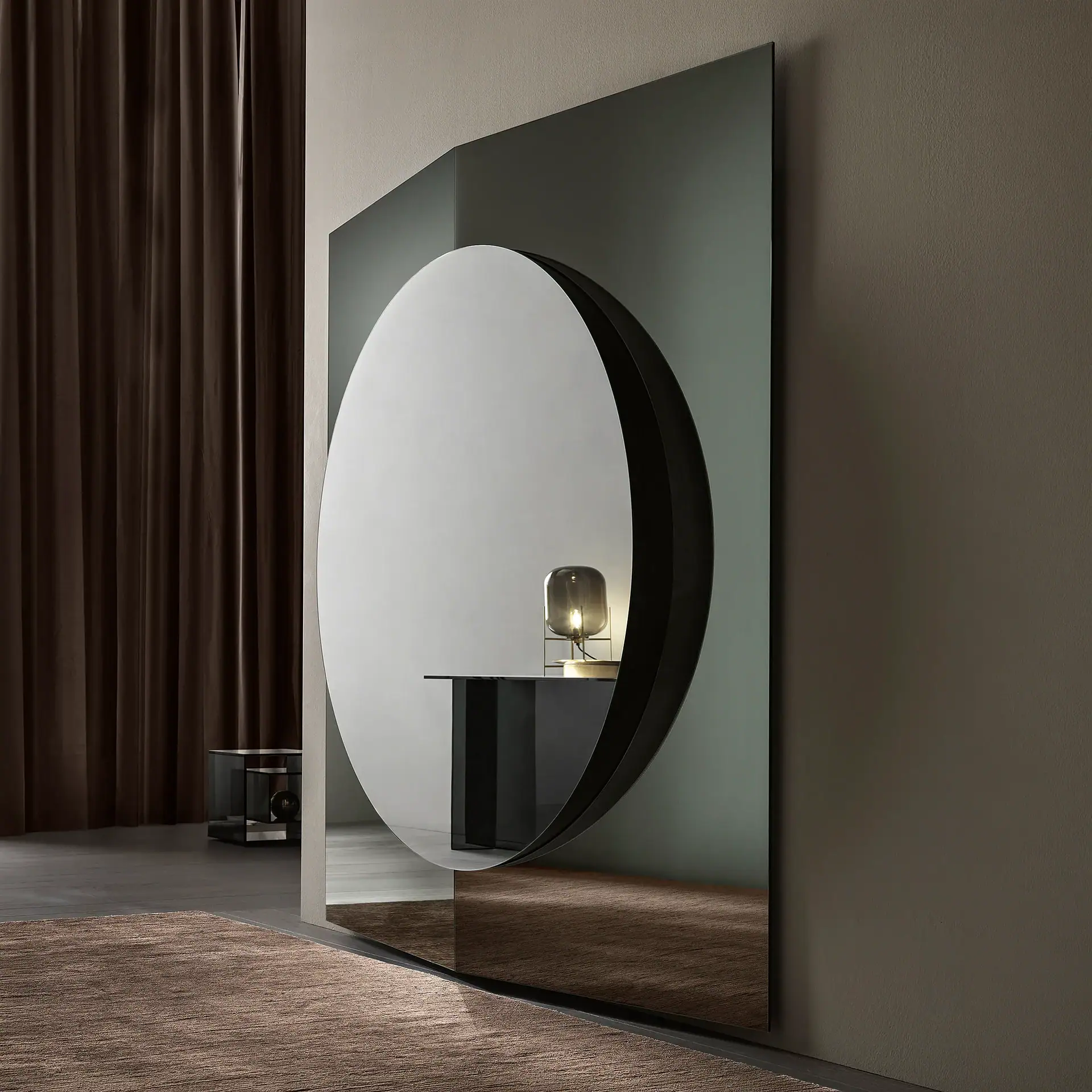 A large rectangular mirror with a circular cut-out reflects a modern interior. A console table with a lamp is visible through the cut-out. Dark curtains and a rug are also present.
