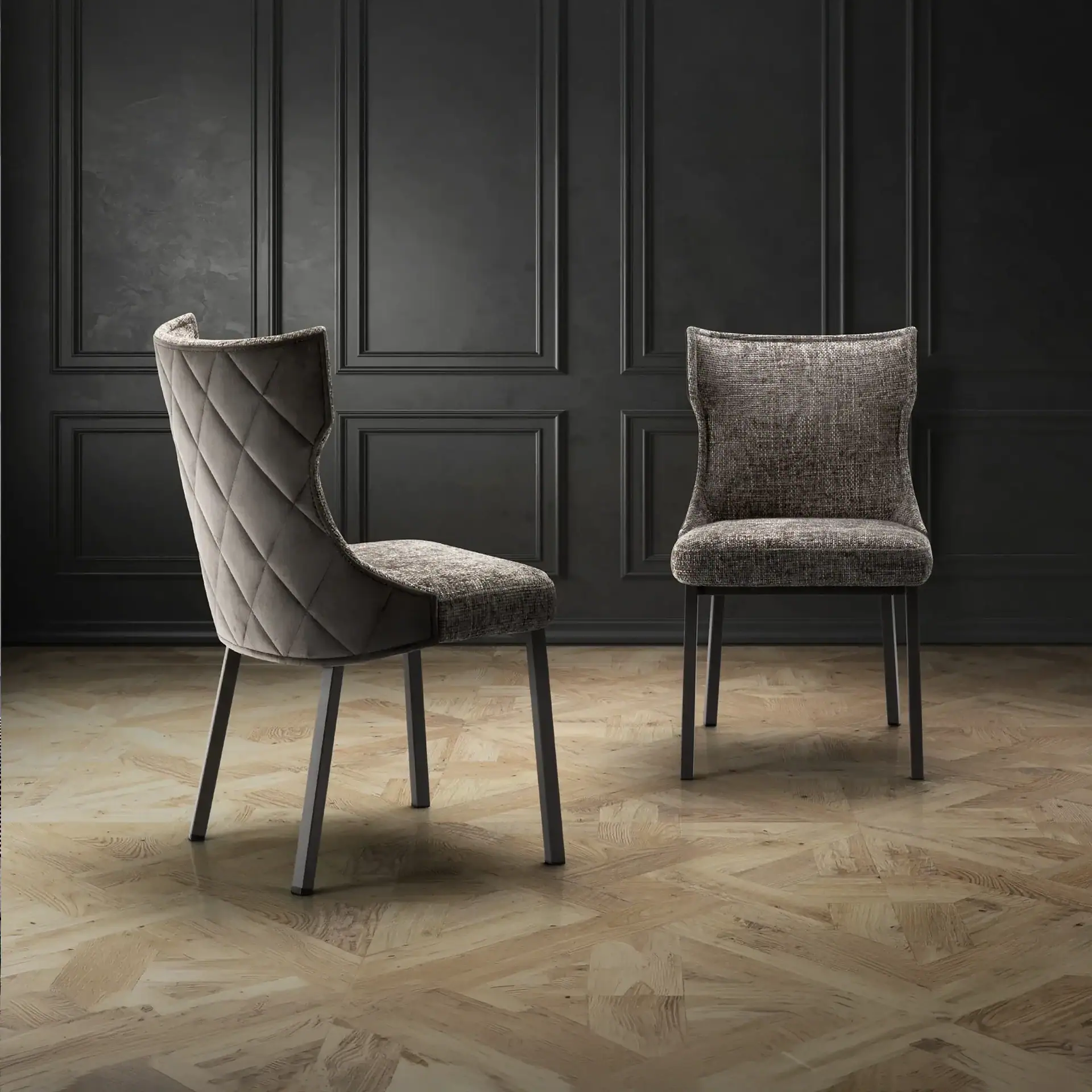 Stylish gray upholstered dining chairs with sleek black legs, perfect for contemporary dining rooms.