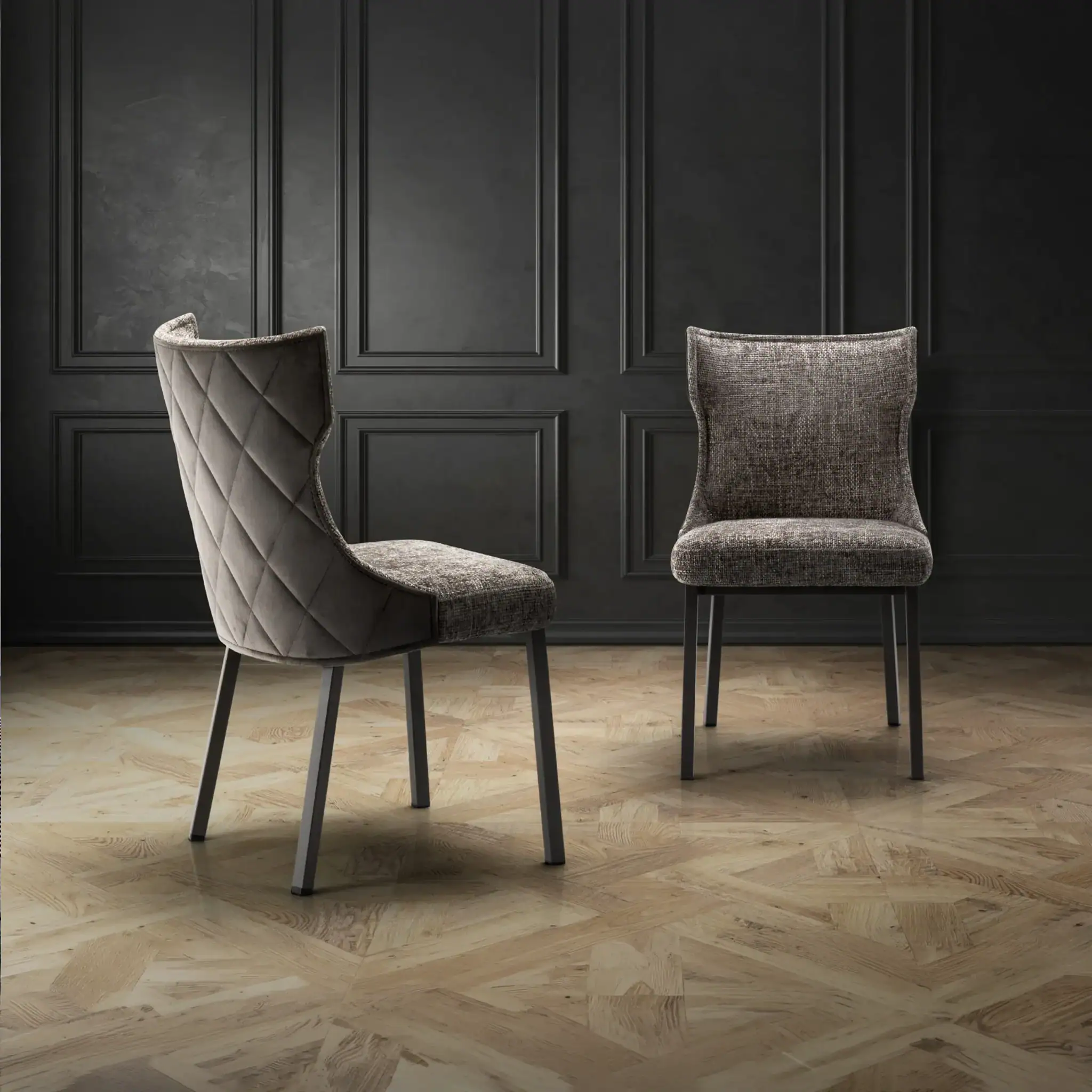 Stylish gray upholstered dining chairs with sleek black legs, perfect for contemporary dining rooms.