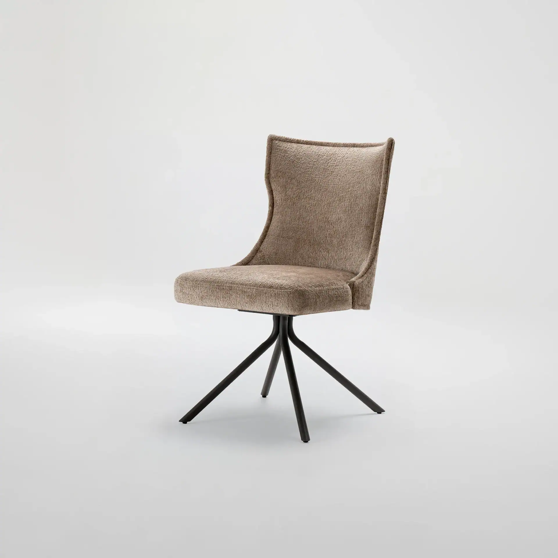 Upholstered accent chair with black metal legs, perfect for modern home interiors.