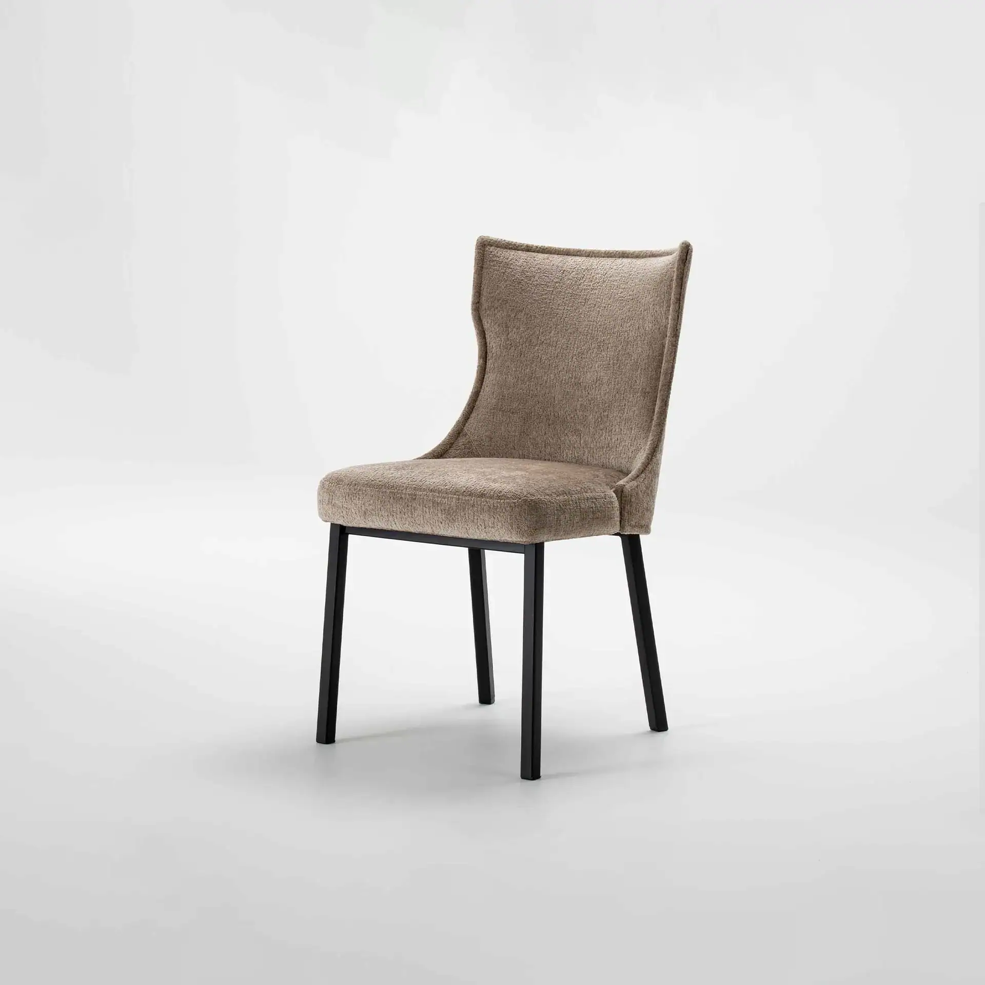 Elegant beige upholstered dining chair with black wooden legs.
