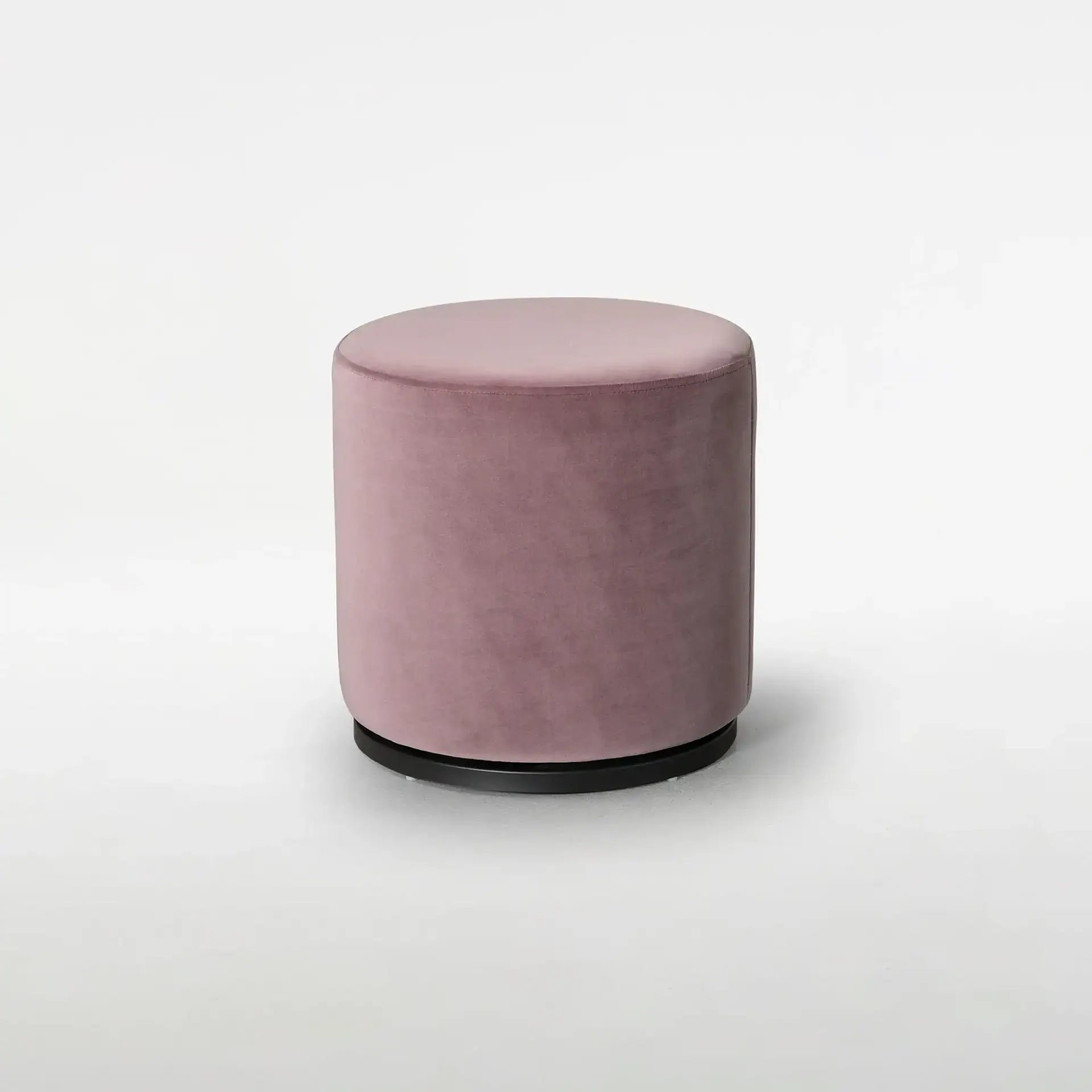 Sklar Furnishings Marshmallow Ottoman in pink fabric on a black base.