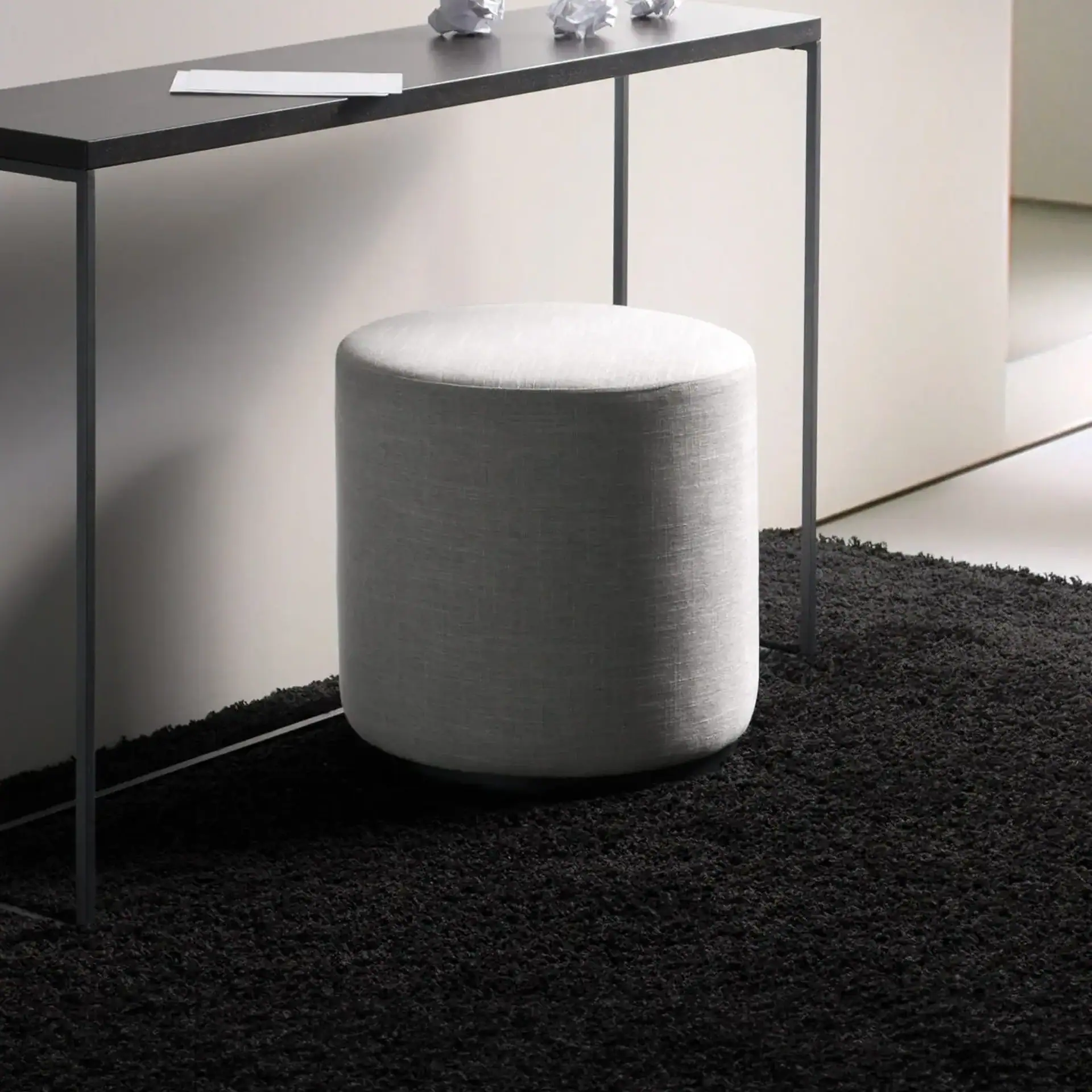Sklar Furnishings Marshmallow Ottoman in a modern room setting.