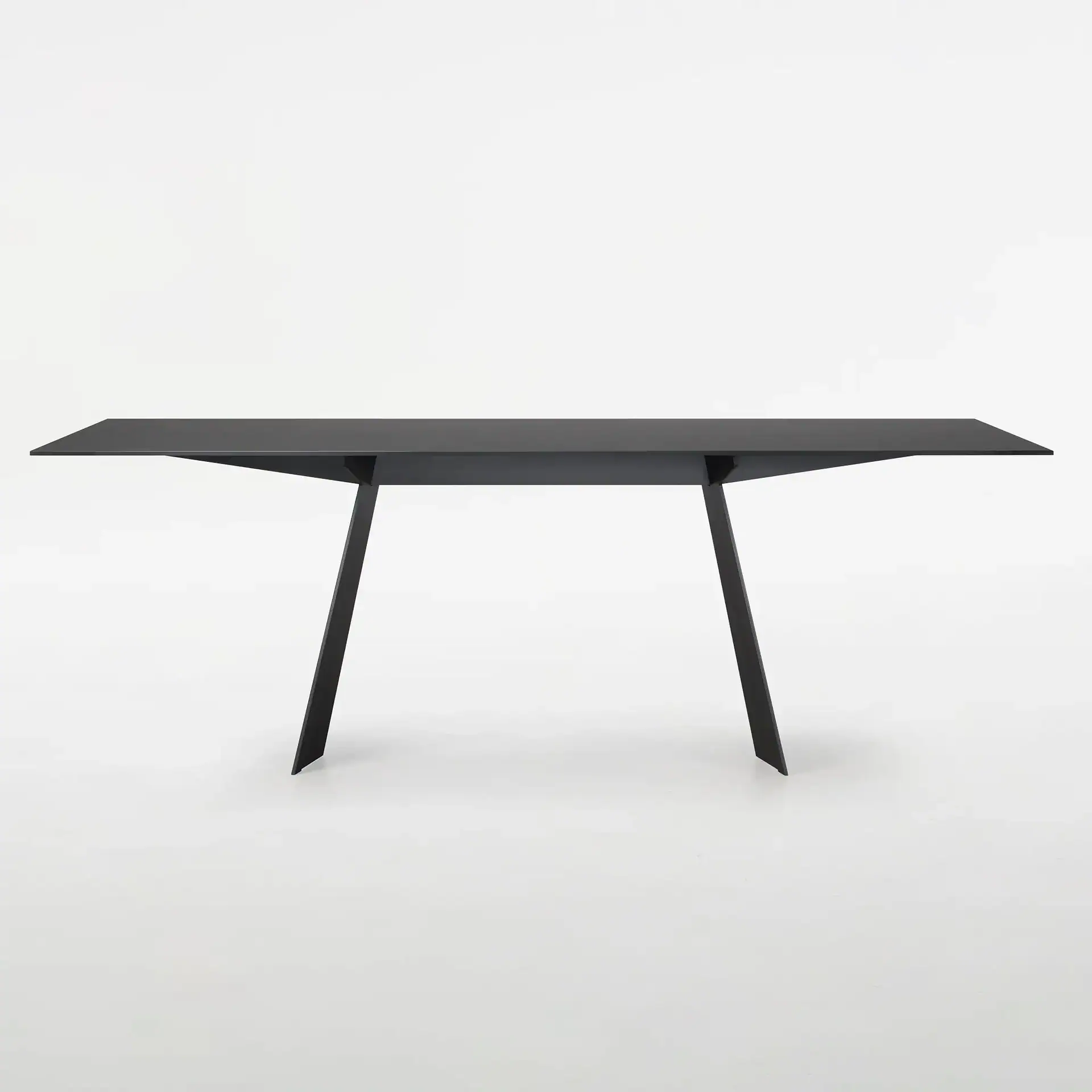 Sleek black desk with minimalist design, ideal for office or home workspace.