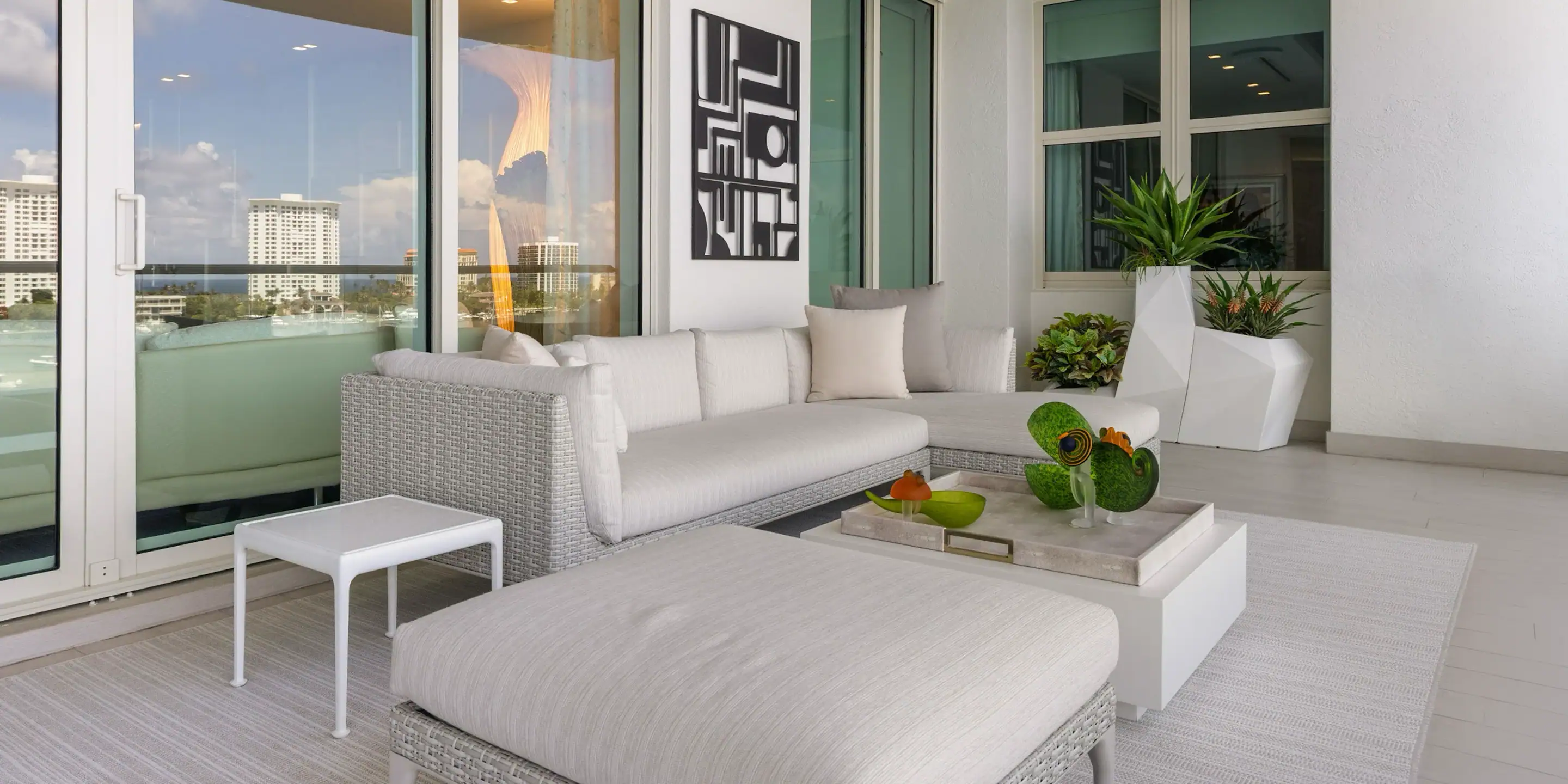 Modern Waterfront Living Room Contemporary living room with white sofa and large windows overlooking water.