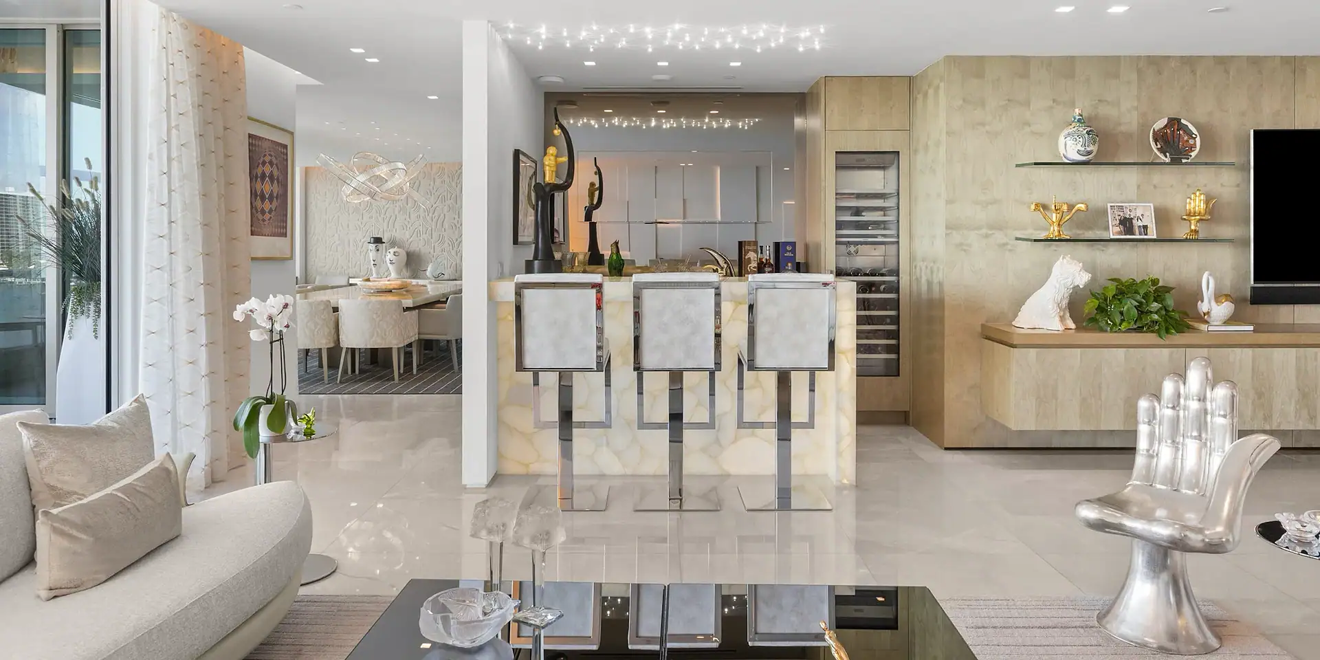 Modern waterfront home interior with open kitchen and living area.