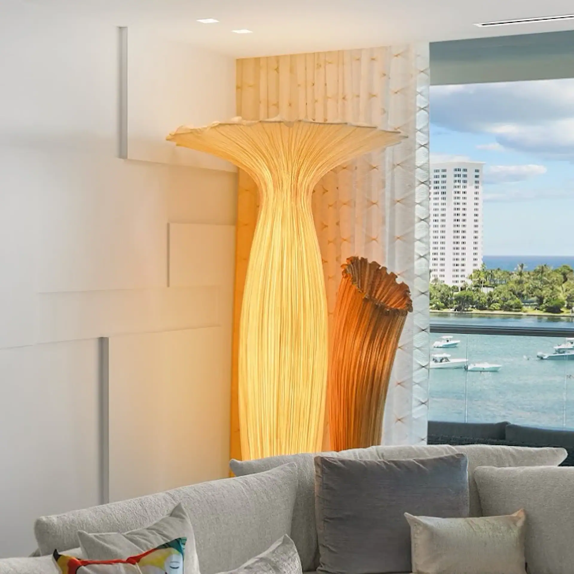 Decorative wooden sculptures near window with water view.