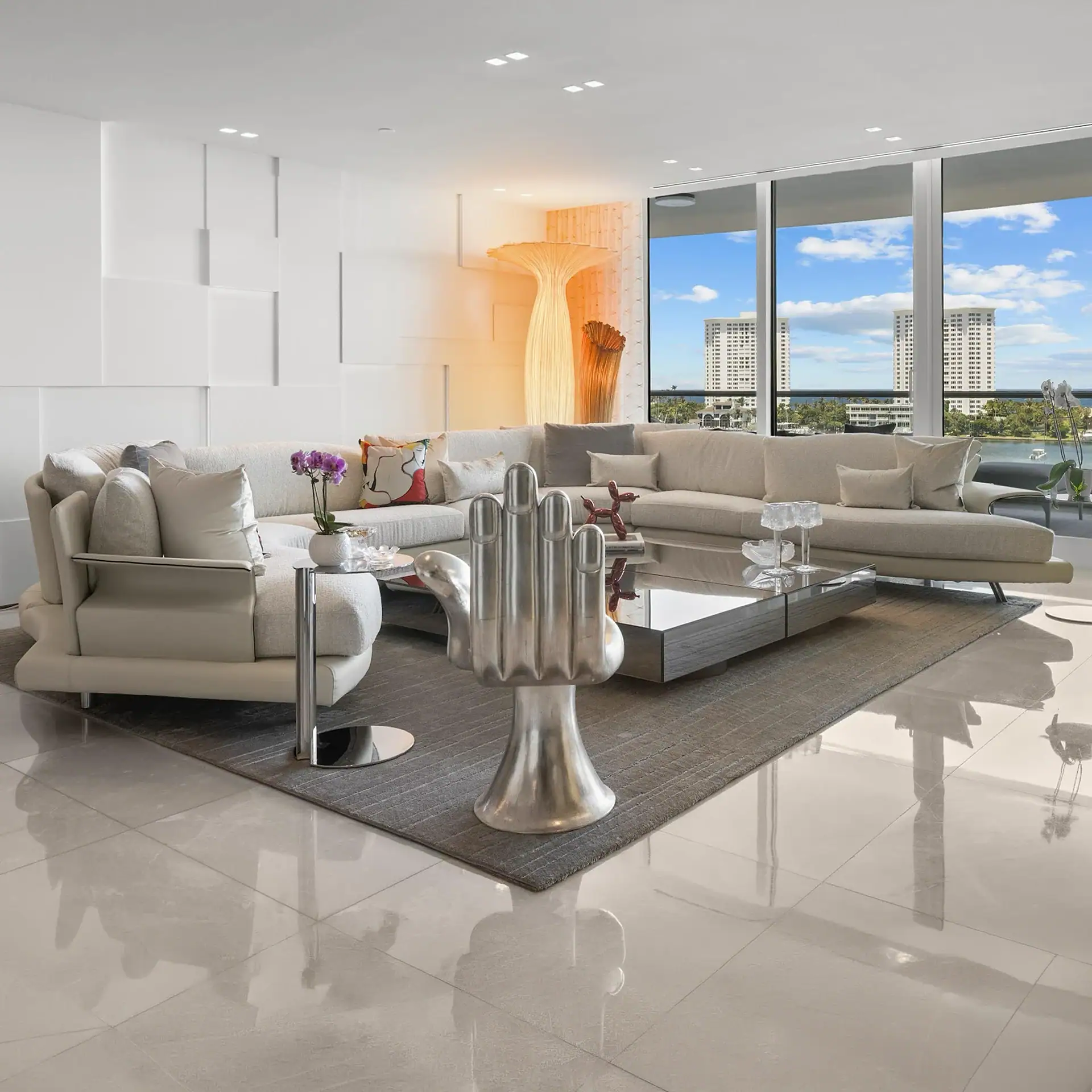 Spacious living room with large windows and contemporary furniture.