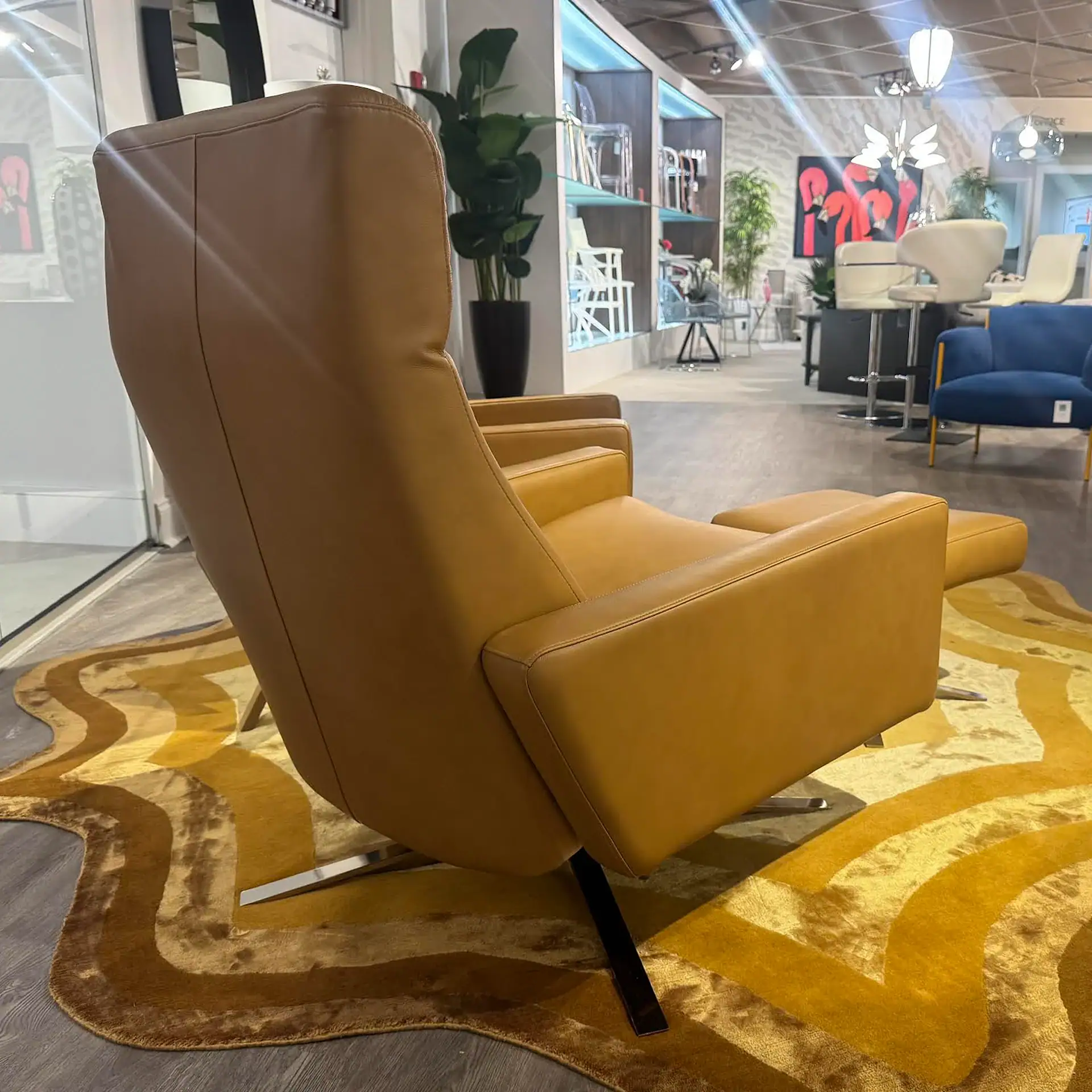 American Leather Cloud XL recliner and ottoman in a showroom setting.