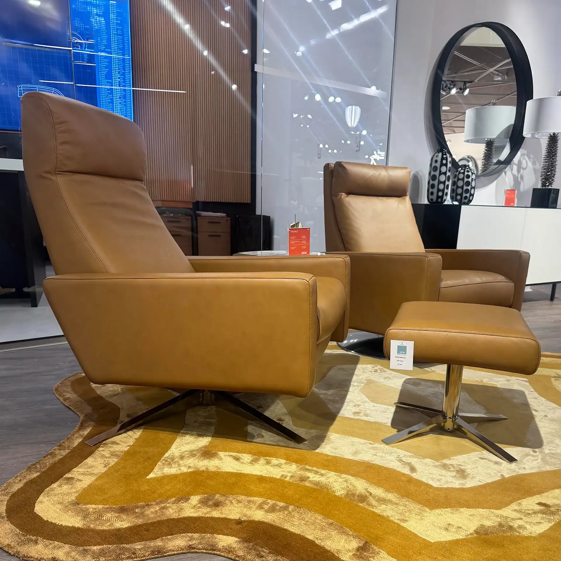 American Leather Cloud XL recliner and ottoman in a showroom setting.