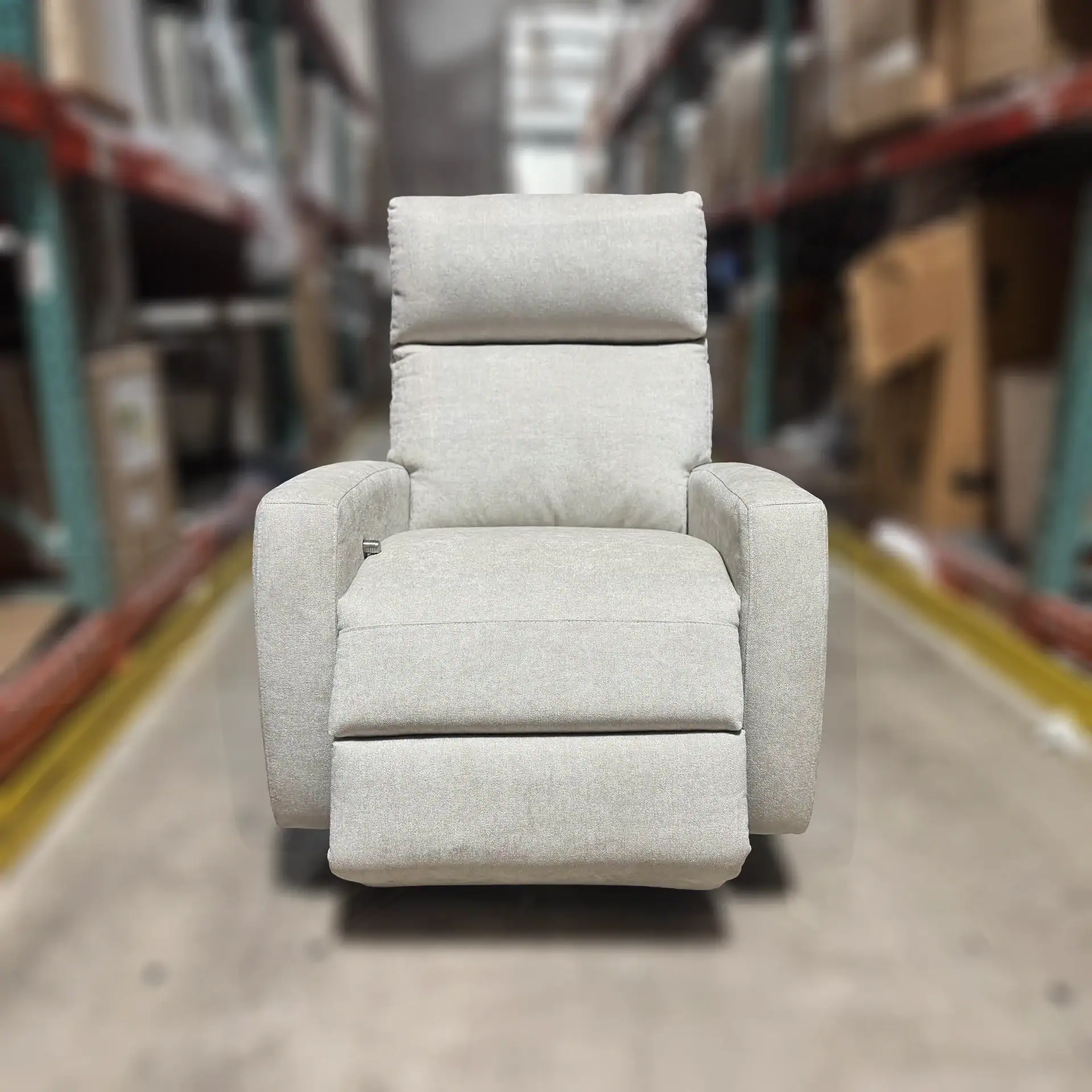 American Leather Elliot Recliner in a warehouse setting.