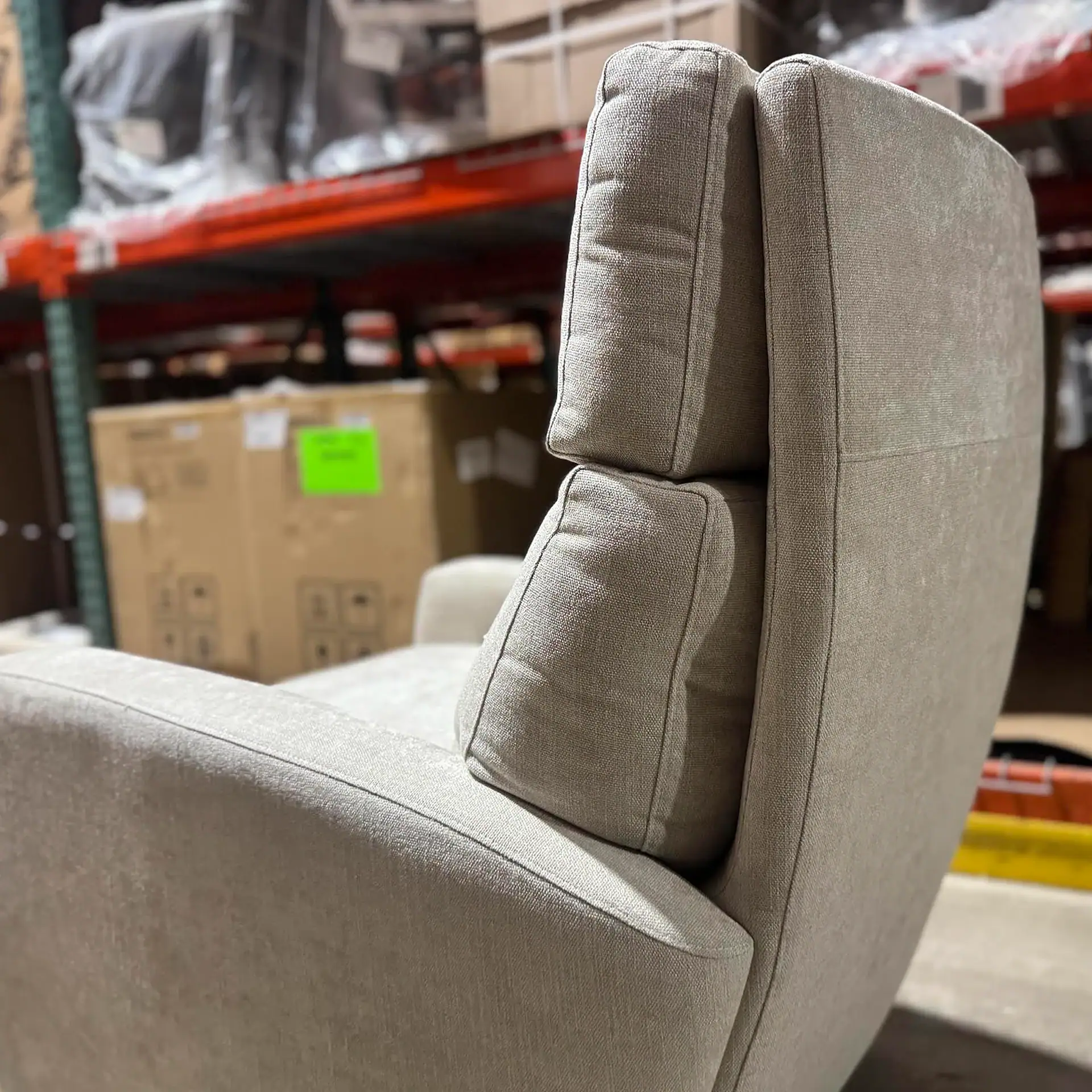 American Leather Elliot Recliner in a warehouse setting.