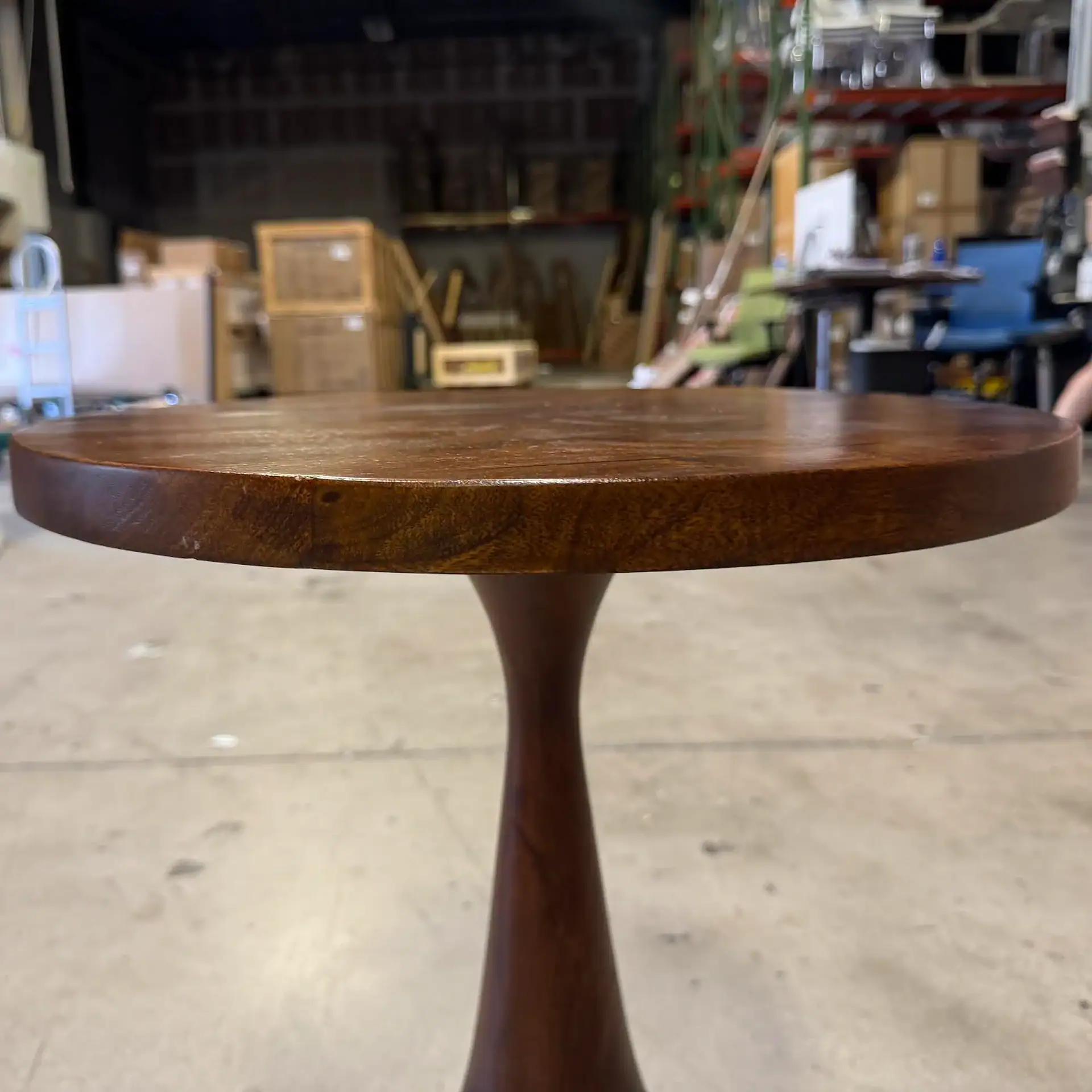Arteriors Darby Accent Table with wooden top and pedestal base.