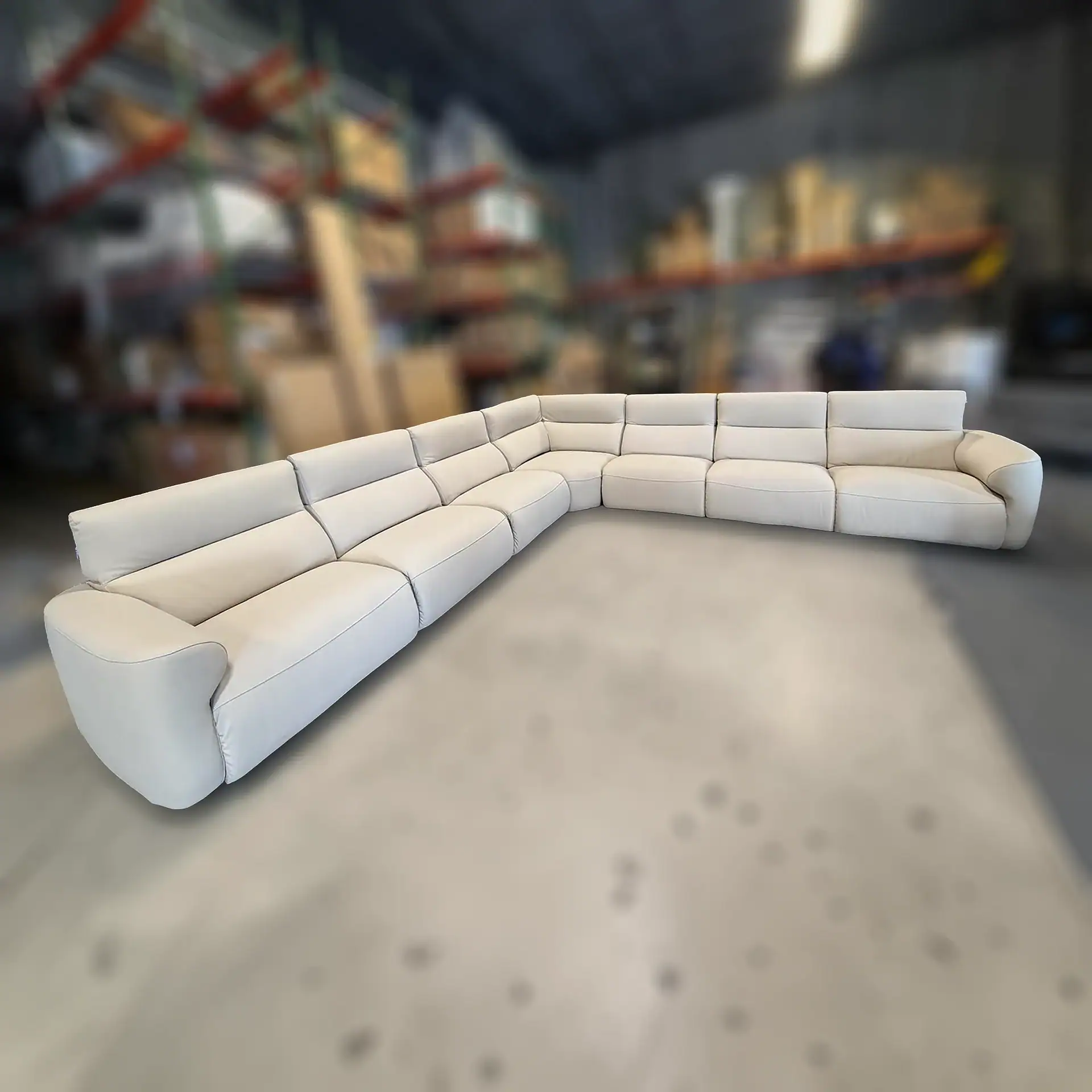 Chateau D’Ax Wonka Sectional sofa in a warehouse setting.