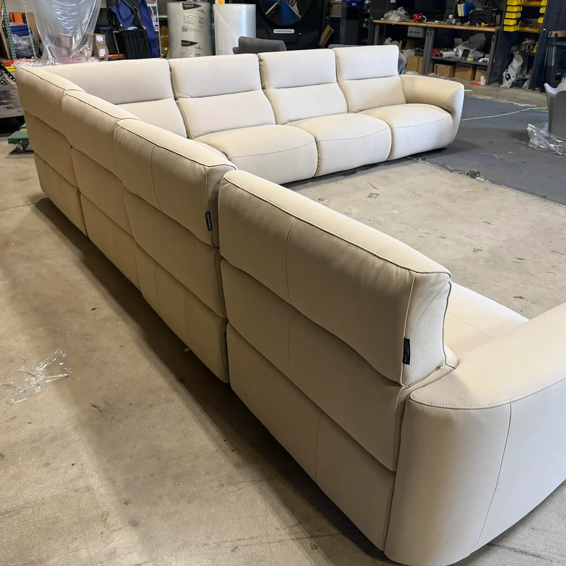 Chateau D’Ax Wonka sectional sofa in a warehouse setting.