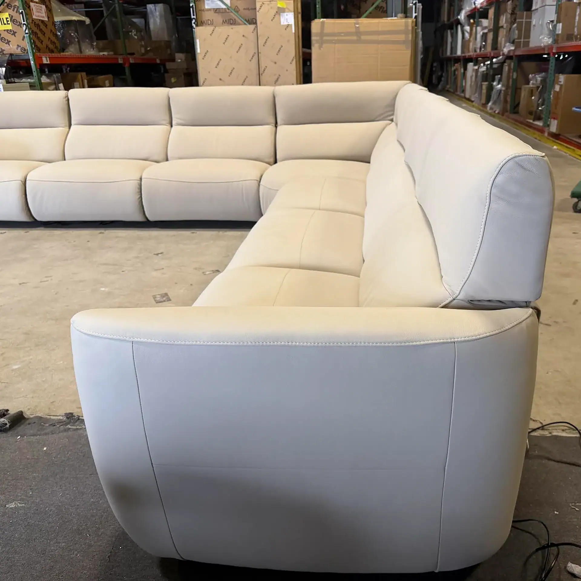 Chateau D’Ax Wonka sectional sofa in a warehouse setting.
