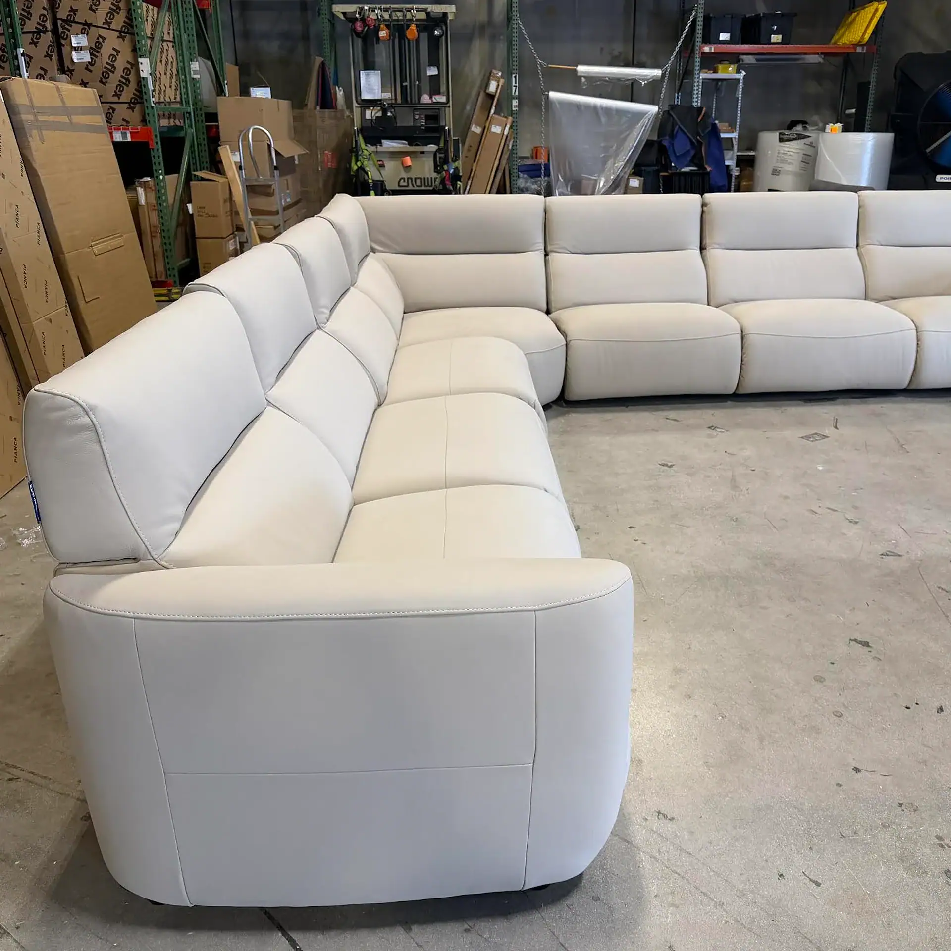 Chateau D’Ax Wonka sectional sofa in a warehouse setting.