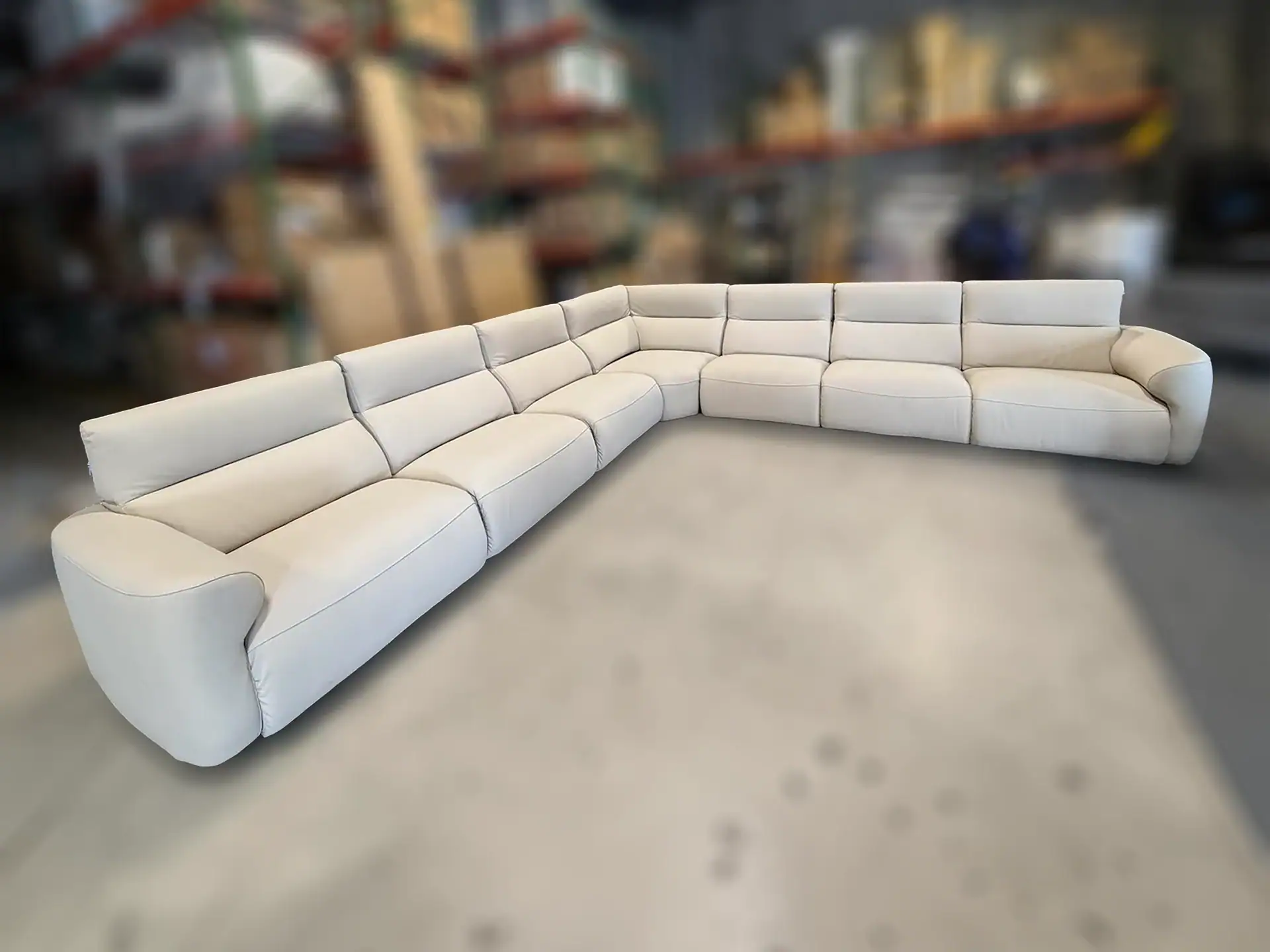 Chateau D’Ax Wonka sectional sofa in a warehouse setting.