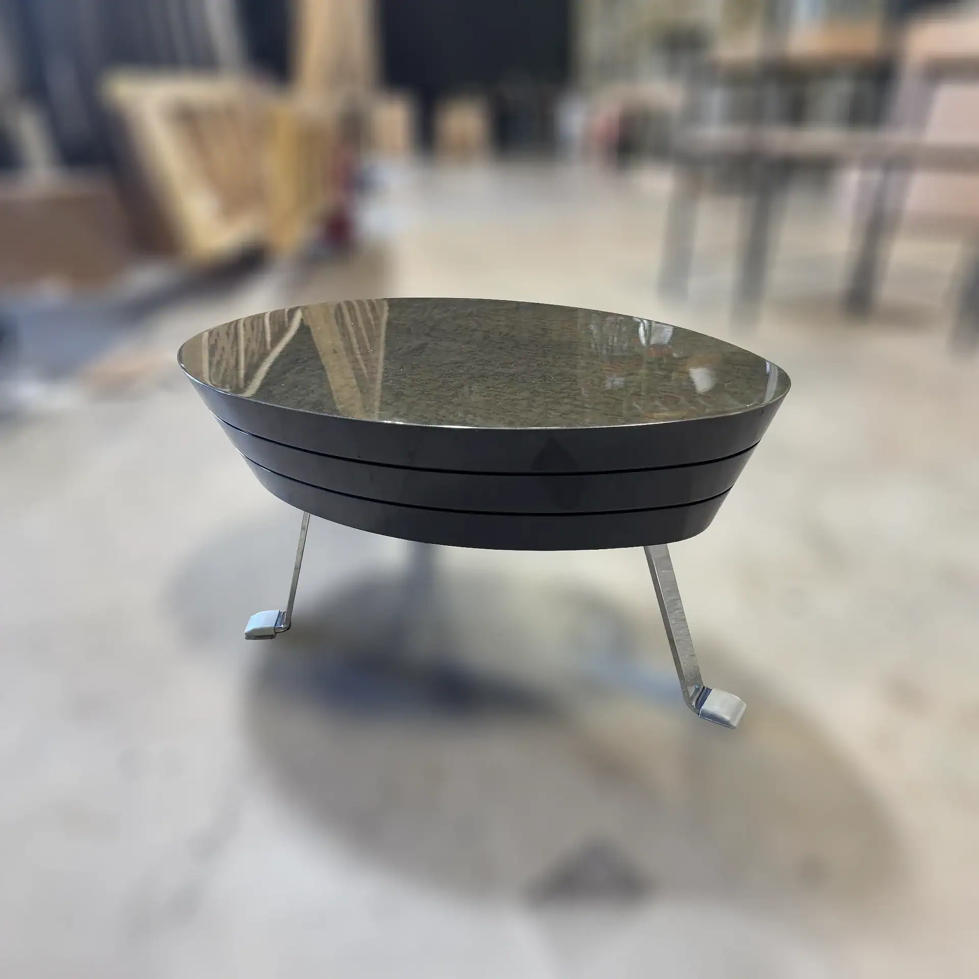 Sklar Furnishings John Low Table with black top and metal legs.